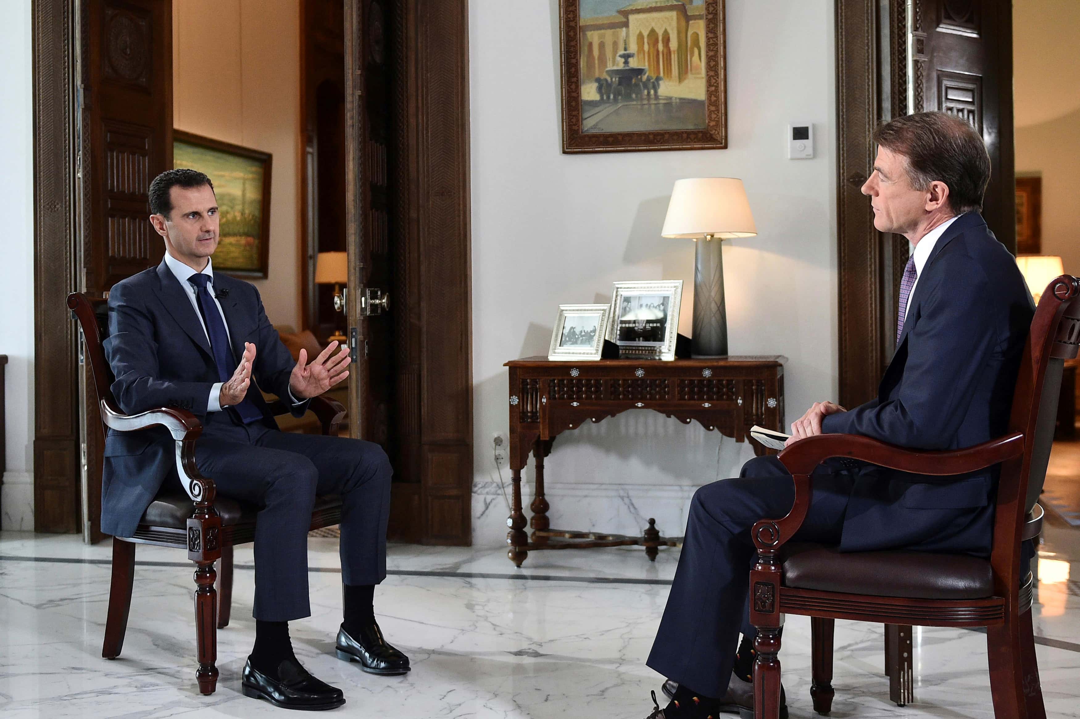 Syria's President Bashar al-Assad (L) speaks during an interview with NBC News in this handout picture provided by SANA on July 14, 2016, SANA/Handout via REUTERS