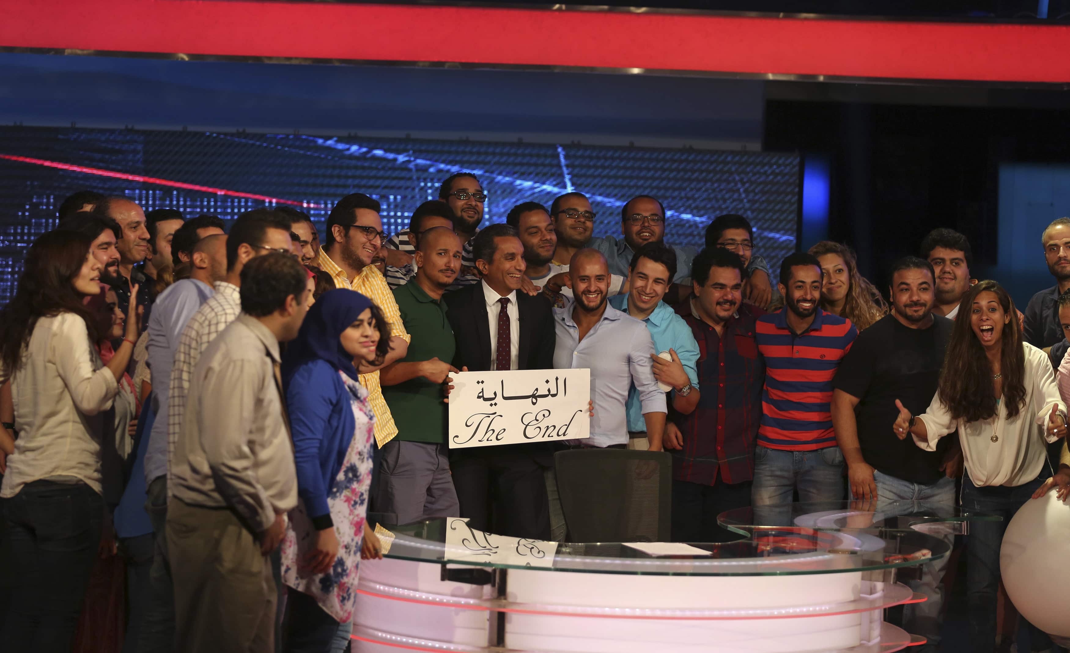 Egyptian satirist Bassem Youssef (C) poses for a photo with the crew of his show 'al-Bernameg' after announcing its cancellation in Cairo on 2 June 2014, REUTERS/Mohamed Abd El Ghany