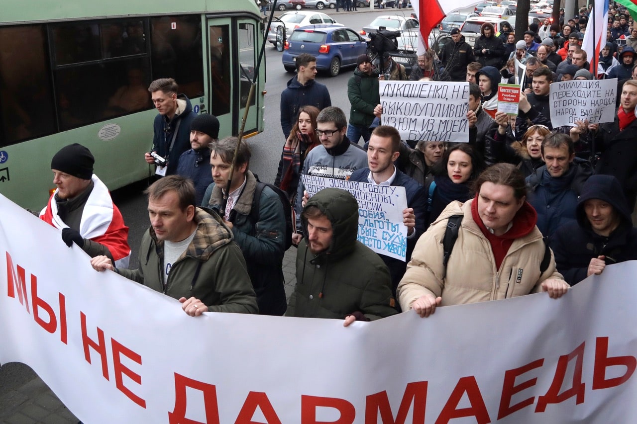 A rally in Minsk, Belarus, 15 March 2017; the banner in the foreground reads "We aren't parasites", AP Photo/Sergei Grits