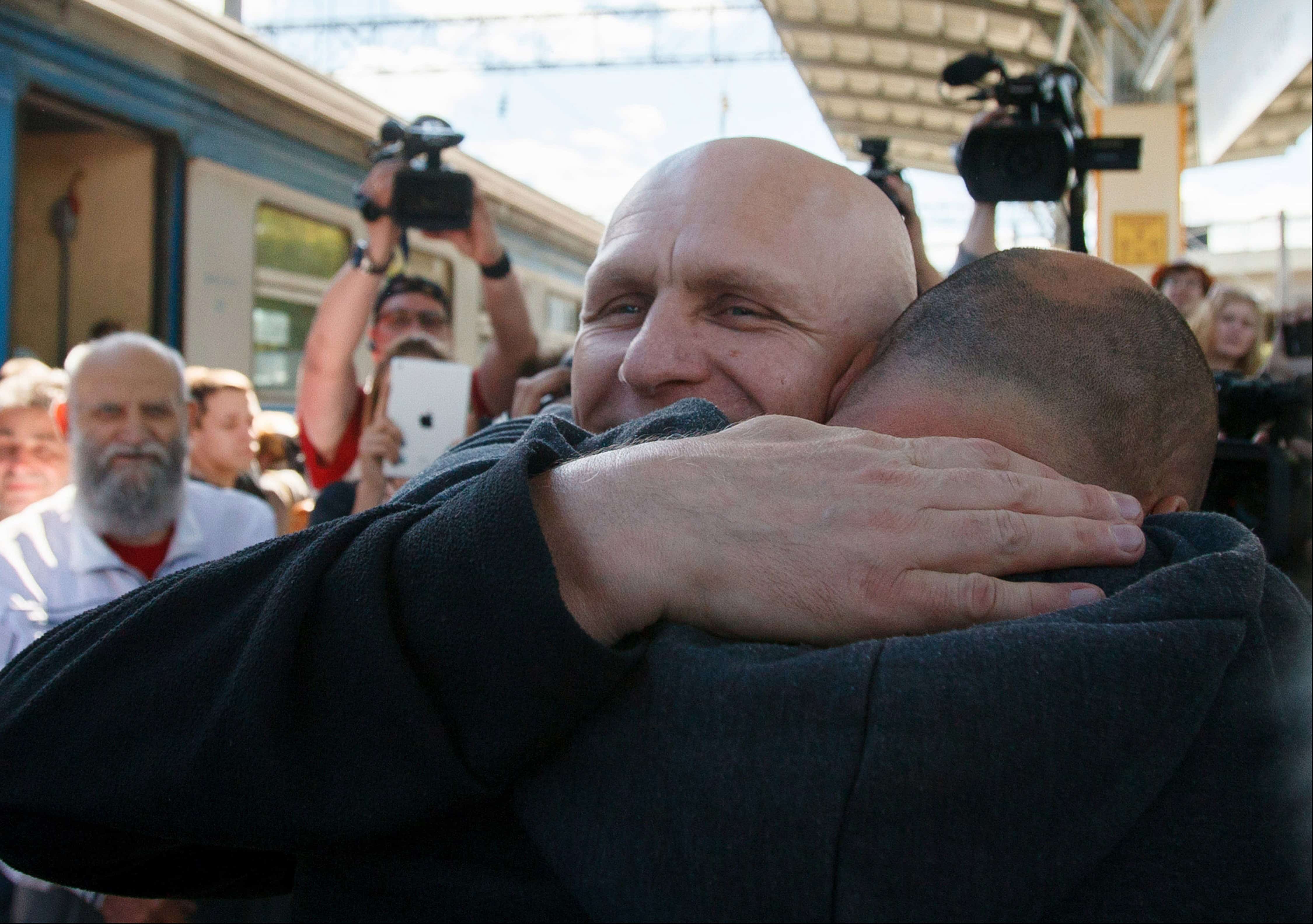 Belarusian human rights advocate Ales Bialiatski is welcomed by his supporters at a railway terminal in Minsk, 21 June 2014, AP Photo/Dmitry Brushko