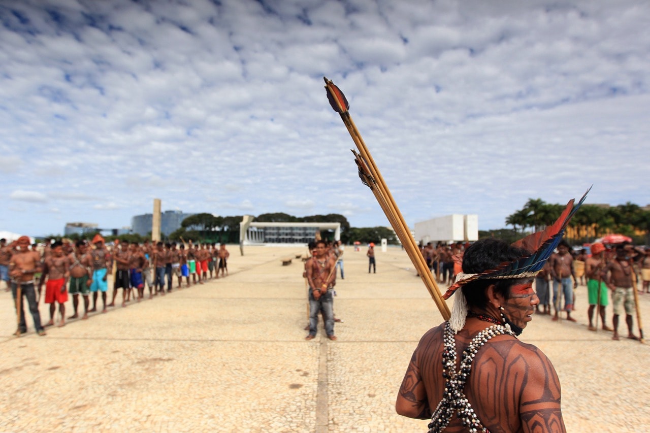 Munduruku Indians gather outside the Planalto Palace in Brasilia during a 6 June 2013 protest, calling for the suspension of the construction of the Belo Monte hydroelectric plant, REUTERS/Ueslei Marcelino