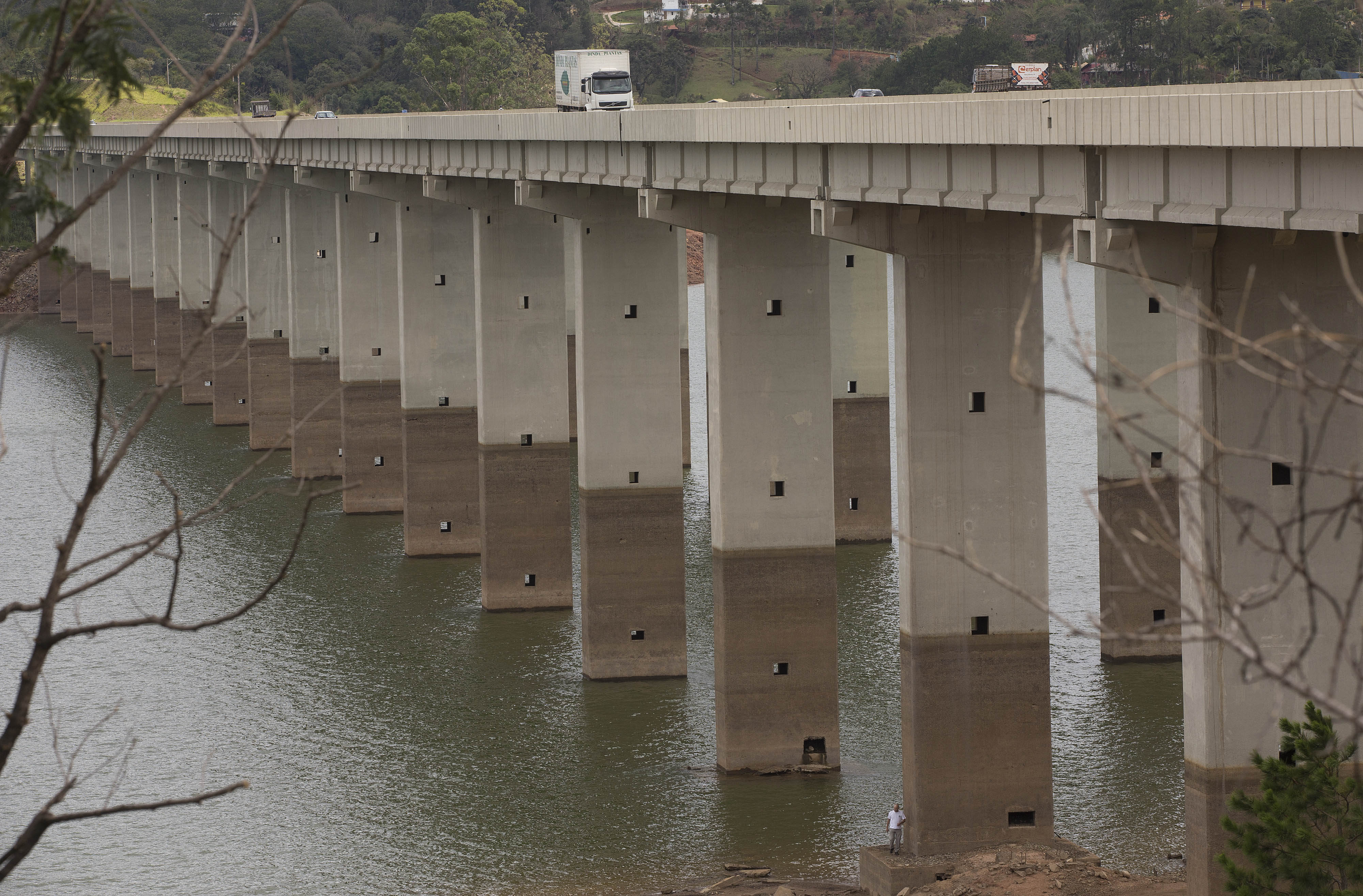 A bridge's columns show the previous water line over the Atibainha reservoir, part of the Cantareira System that provides water to the Sao Paulo metropolitan area, AP Photo/Andre Penner