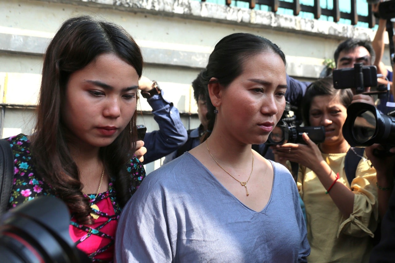 Chit Su Win (L) and Panei Mon (R), wives of jailed  journalists Kyaw Soe Oo and Wa Lone respectively, leave the Yangon Regional High Court in Yangon, Burma, 11 January 2019, SAI AUNG MAIN/AFP/Getty Images