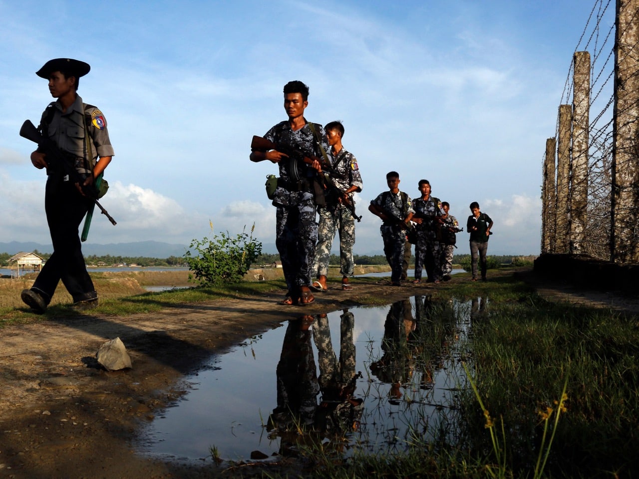 Police officers patrol along the border fence between Burma and Bangladesh in Maungdaw, Rakhine State, 14 October 2016, AP Photo/Thein Zaw