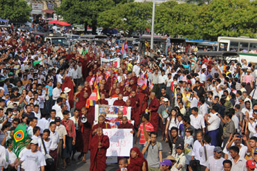 Buddhist monks and residents of Rangoon took to the streets on 12 December to show solidarity with those injured in a police crackdown at a copper mine in late November, Hein Htet/Mizzima