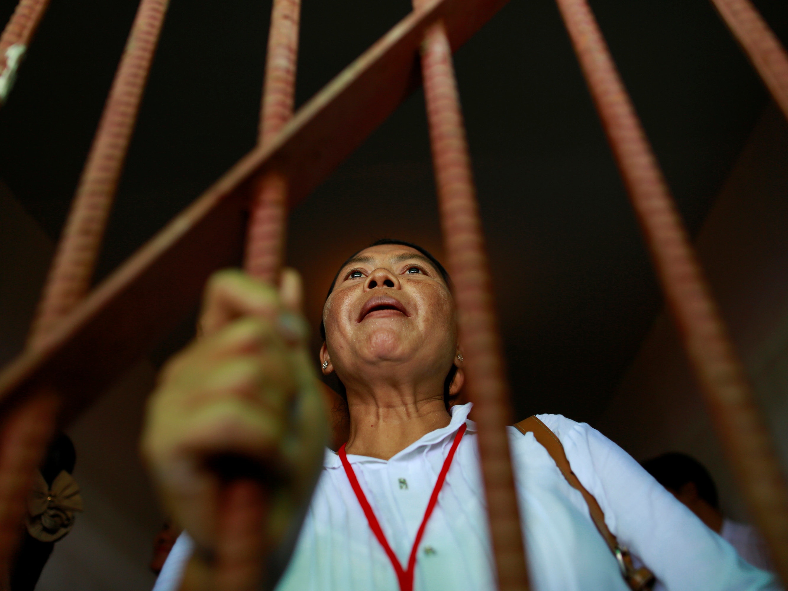 A former political prisoner talks from behind a fake cell at the opening ceremony of a memorial and exhibition marking the 25th anniversary of the "8888" democratic uprising, in Rangoon 6 August 2013, REUTERS/Soe Zeya Tun