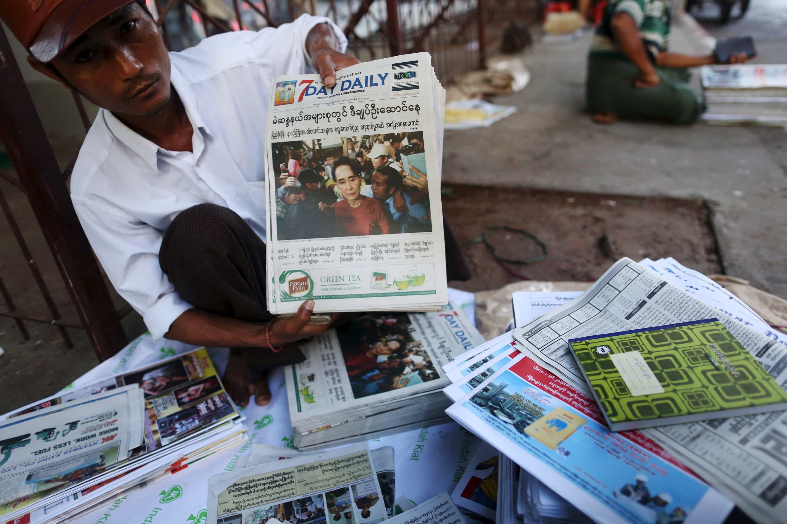 A news vendor displays local newspapers on a street in Yangon, 9 November 2015, REUTERS/Soe Zeya Tun