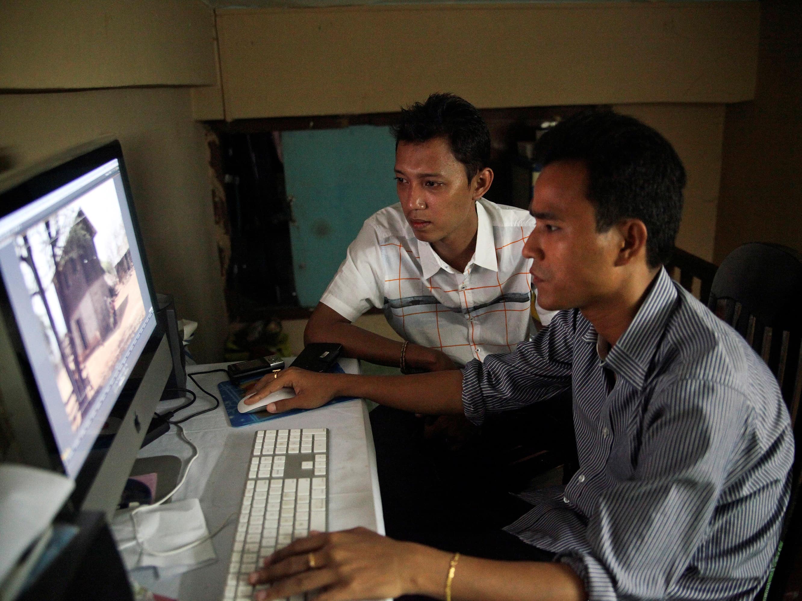 On 19 July 2013, movie director Zay Par (L) and his editor Zin Thaw put the finishing touches to a film that harks back to a 1988 student uprising brutally put down by military rulers, REUTERS/Jared Ferrie