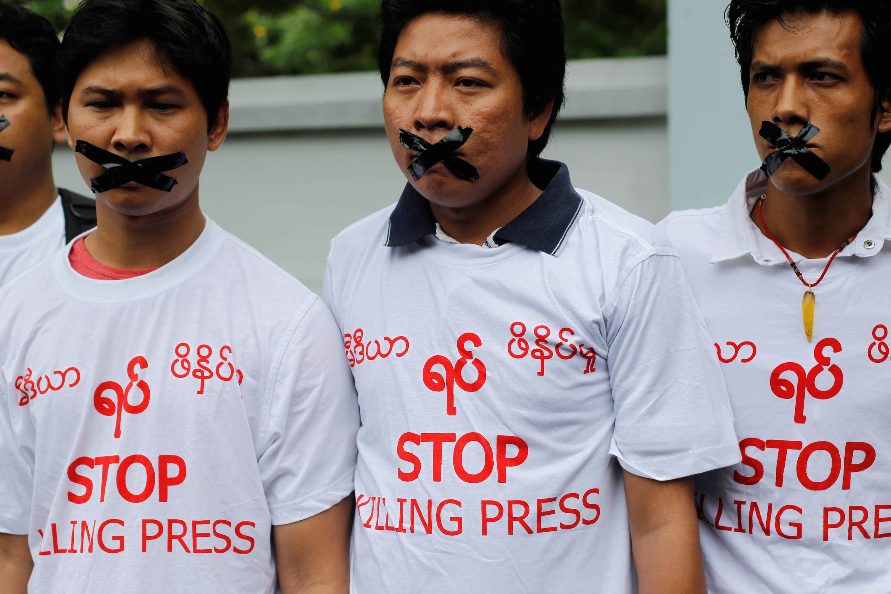 Journalists protest in front of the Myanmar Peace Center in Yangon, 12 July 2014, REUTERS/Soe Zeya Tun