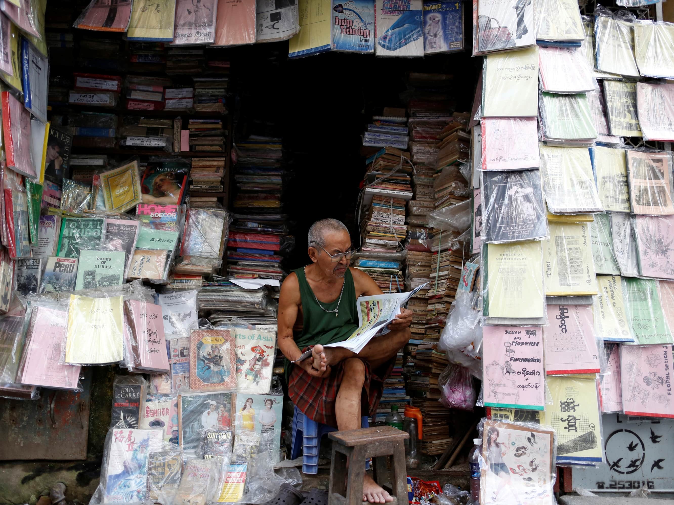 Newspaper and book vendor in Yangon, 8 July 2013 , REUTERS/Soe Zeya Tun