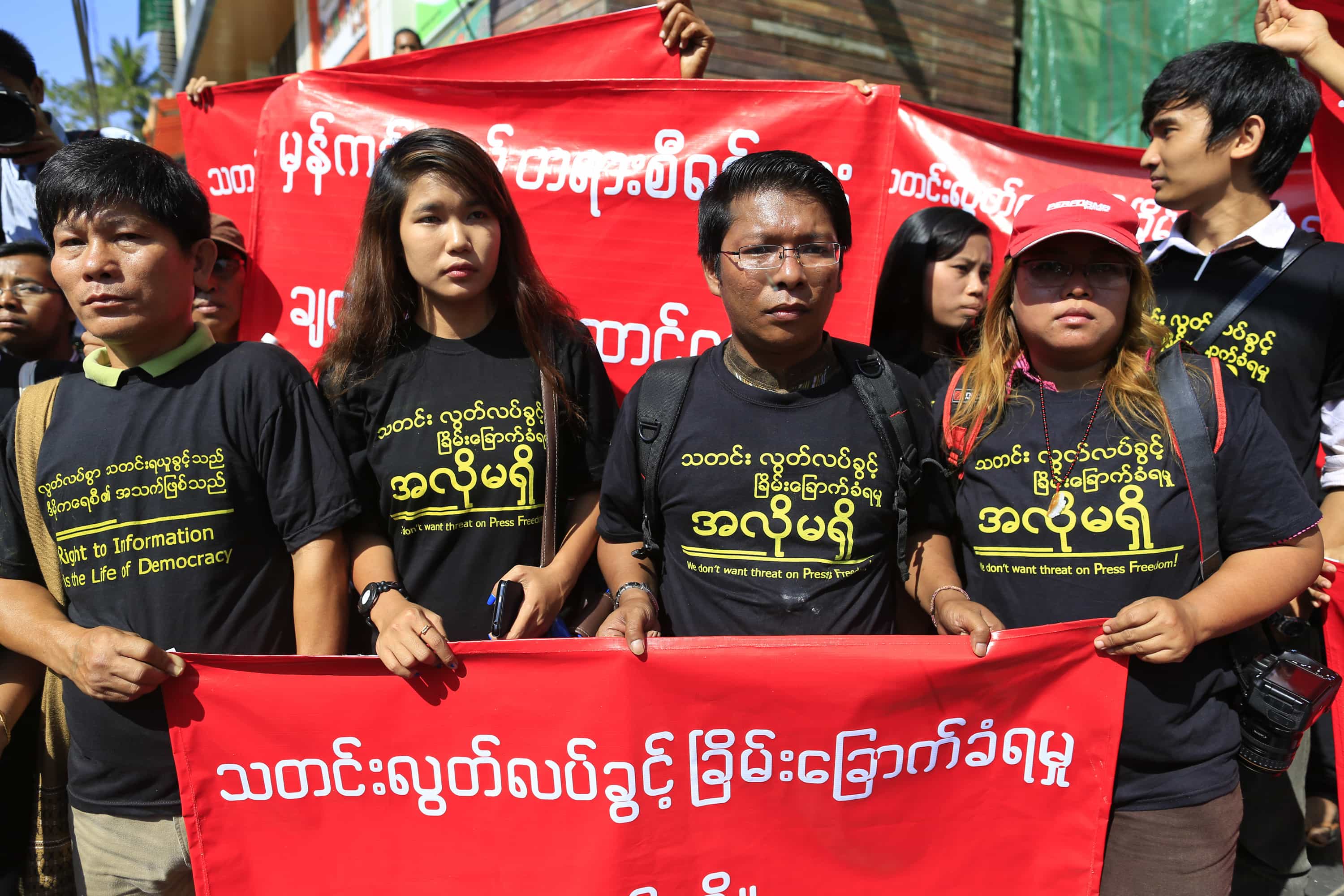 Reporters march for press freedom in Yangon, 7 January 2014; the banners read: "We don't want threats to press freedom", REUTERS/Soe Zeya Tun