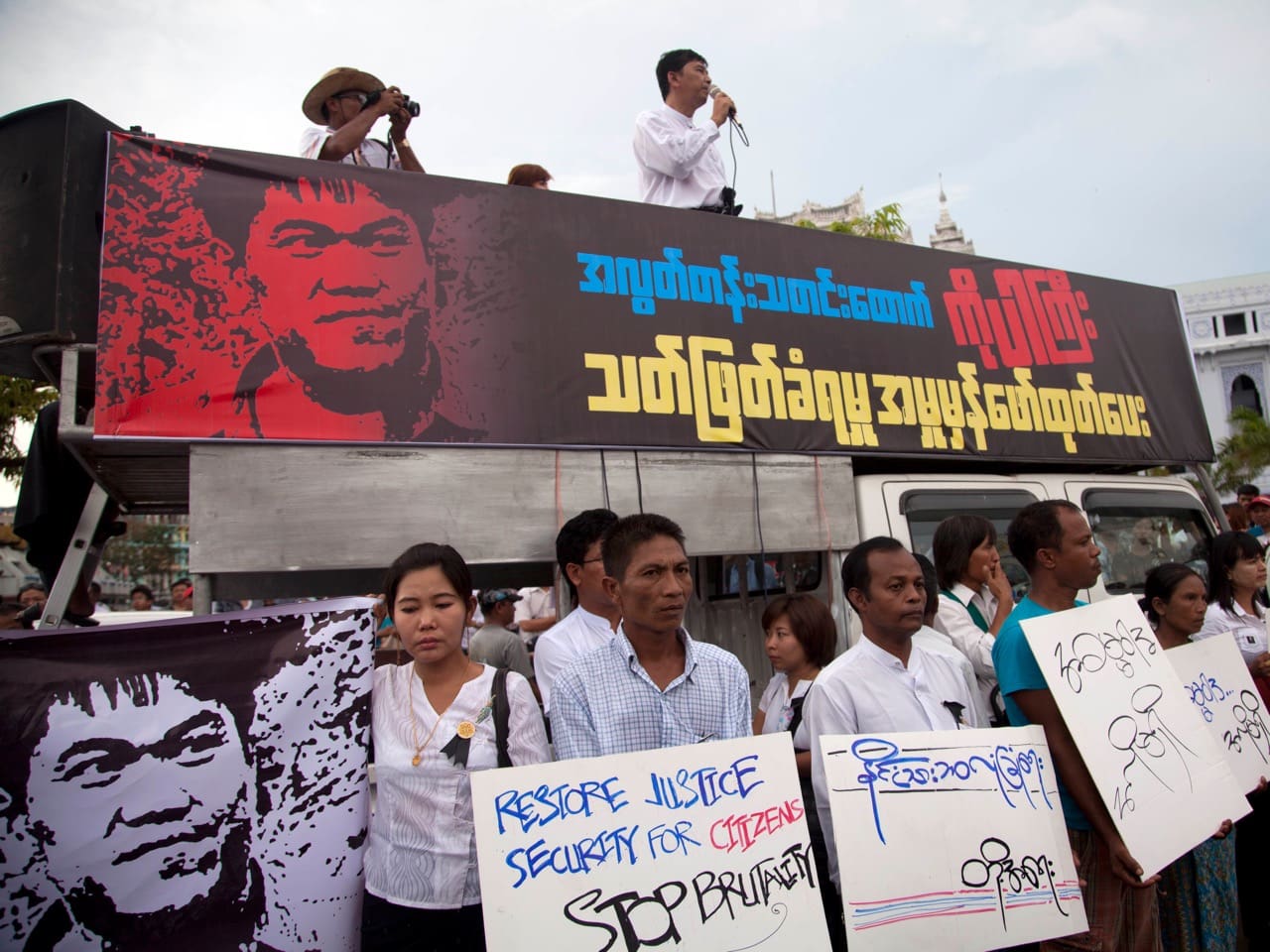 In this 26 October 2014 file photo, a leader of the Myanmar Prominent 88 Generation Students Group speaks in Yangong during a protest against the killing of journalist Par Gyi, AP Photo/Khin Maung Win, File