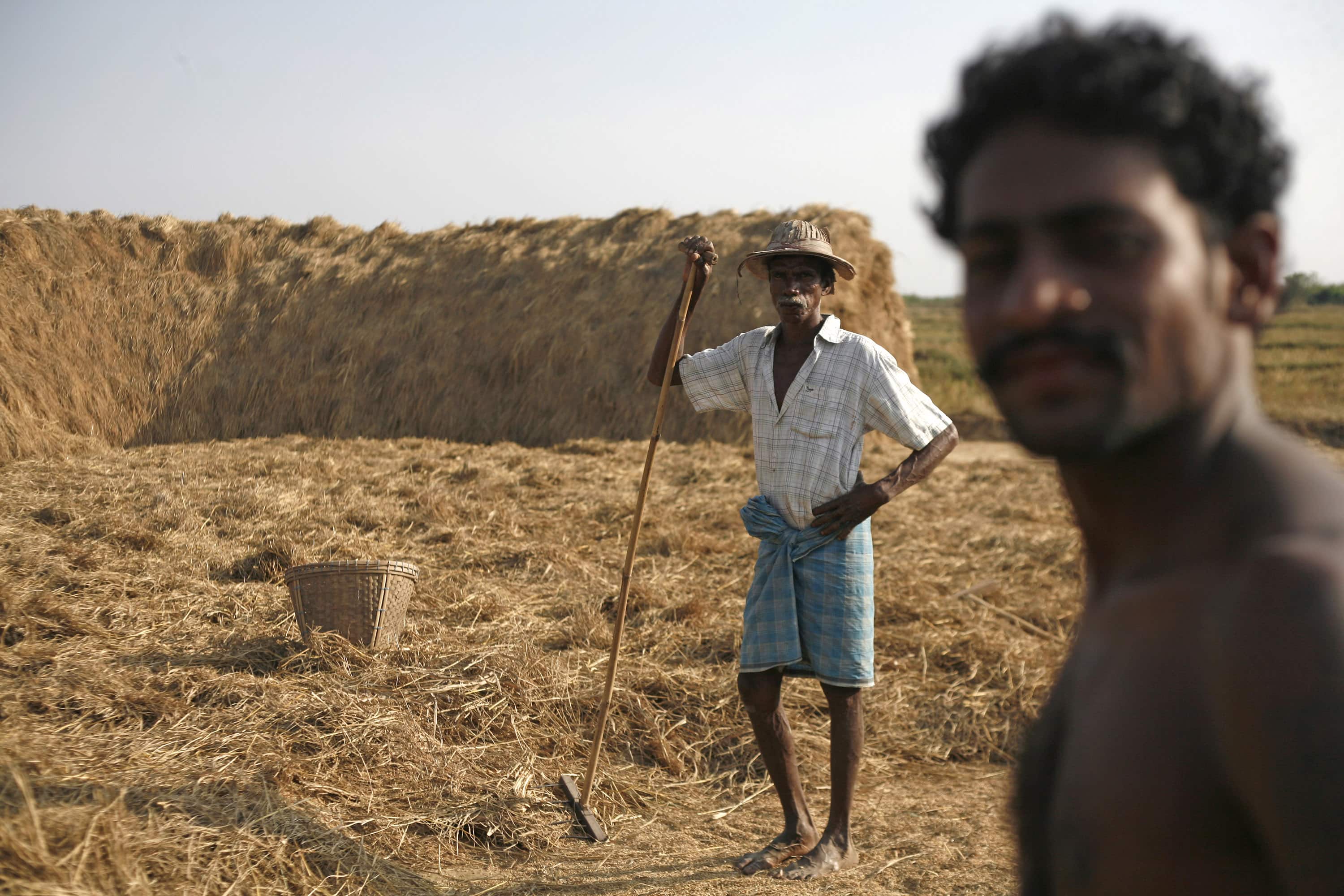 Farmers work in their field in the Thilawa economic zone, outside Yangon, 6 January 2013, REUTERS/Minzayar