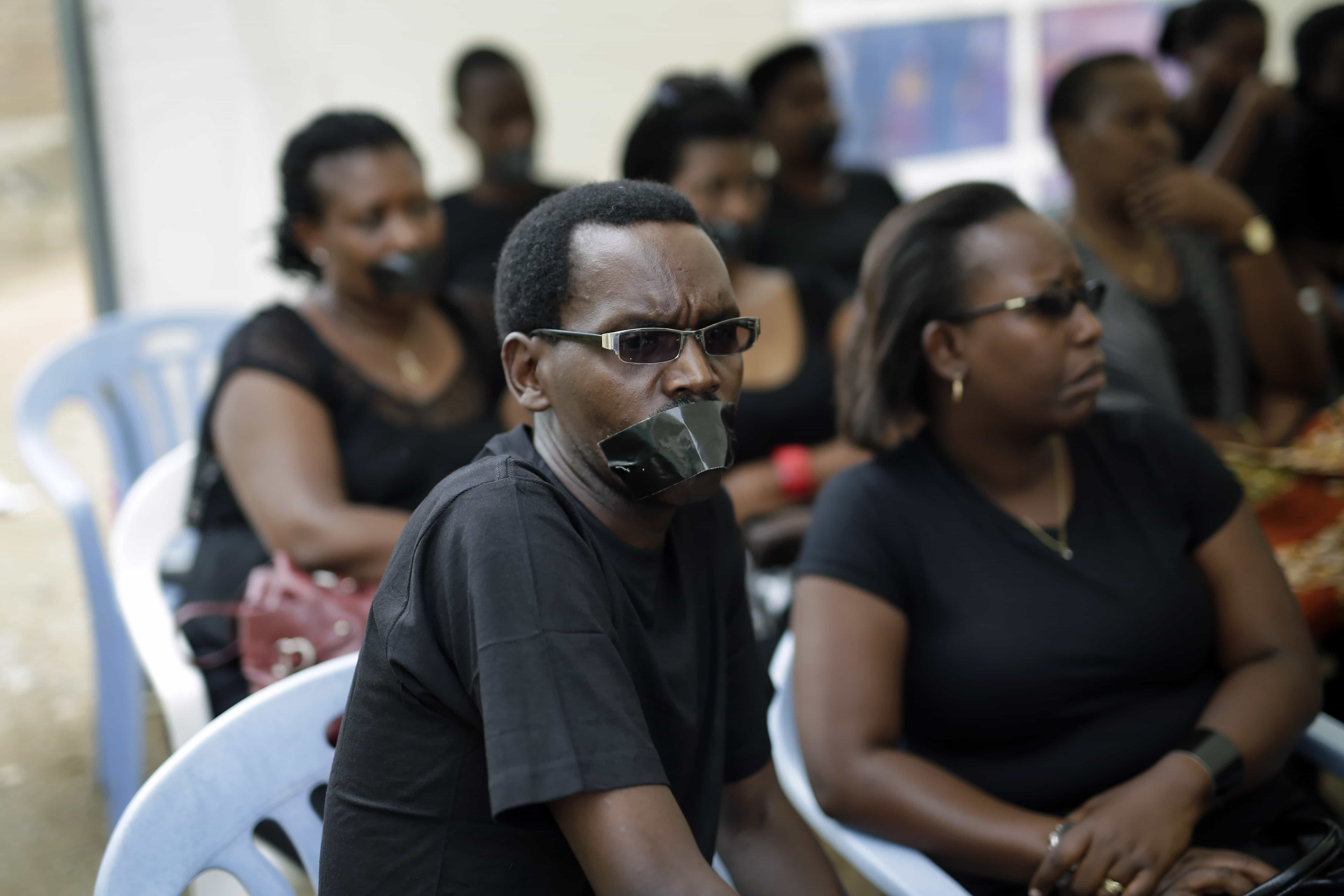 Journalists, some of them with tape on their mouths, gather on the occasion of World Press Freedom Day, in Bujumbura, 3 May 2015, AP Photo/Jerome Delay