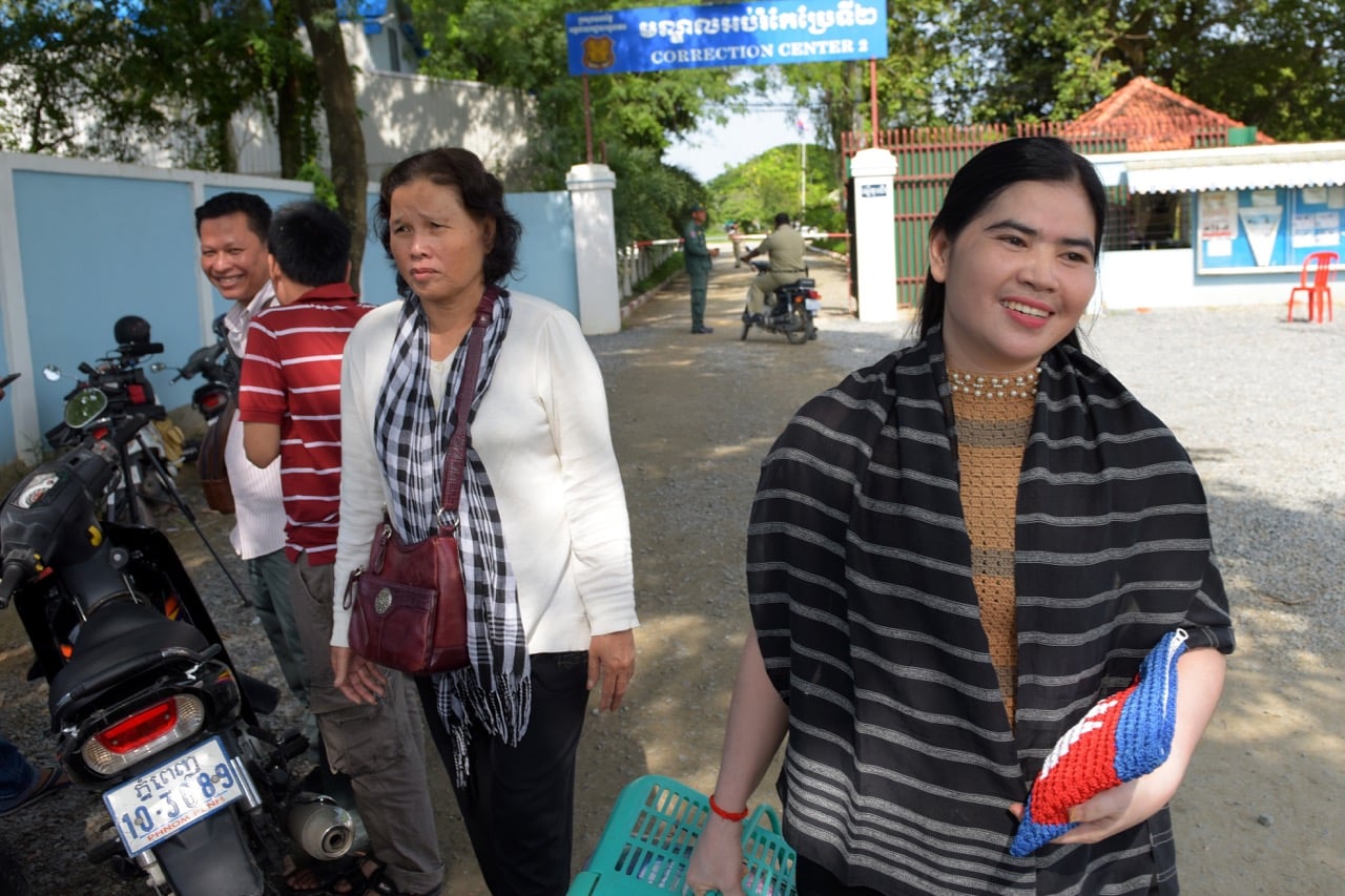 Land rights activist Tep Vanny (R) carries her belongings outside Prey Sar prison in Phnom Penh, Cambodia, on 21 on August 2018 after she was released by a Royal pardon on 20 August, TANG CHHIN SOTHY/AFP/Getty Images