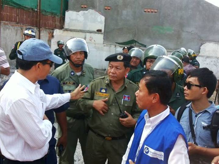 Authorities question people participating in a march for Yorm Bopha, including CCHR representatives, 4 September 2013, CCHR