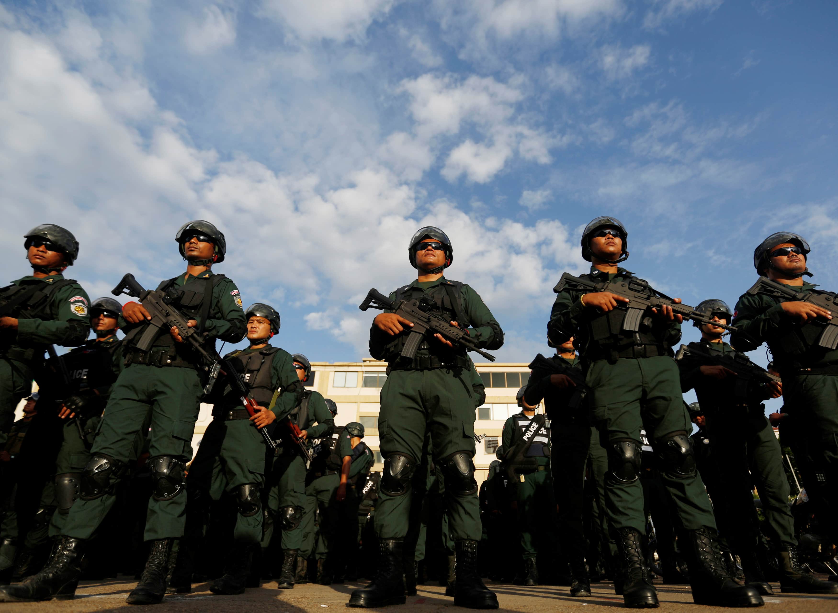 Cambodia's armed forces display anti-riot gear and assault rifles at the Olympic stadium ahead of a general election this weekend, in Phnom Penh, Cambodia, July 25, 2018. , REUTERS/Samrang Pring