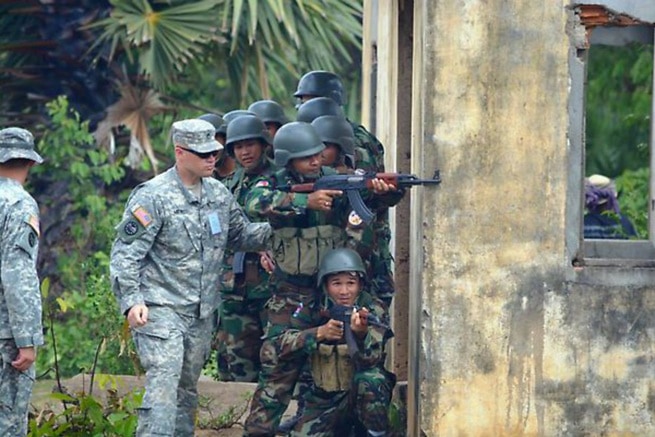 US troops at Angkor Sentinel train Cambodian gendarmes in seizing a building in an urban environment, US Government photo