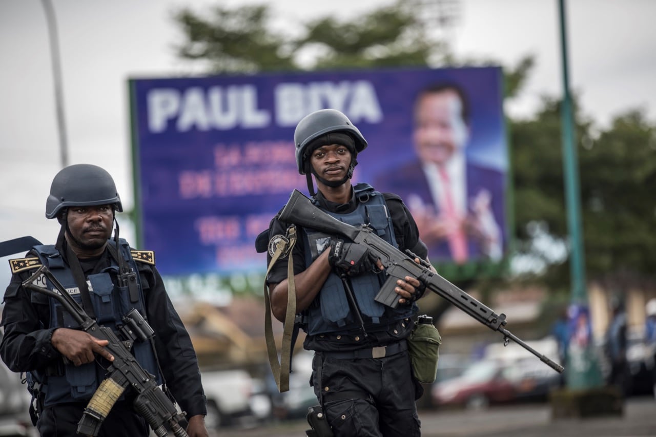 Members of the Cameroonian Gendarmerie patrol during a political rally in Buea, capital of Cameroon's majority anglophone South West province, 3 October 2018, MARCO LONGARI/AFP/Getty Images