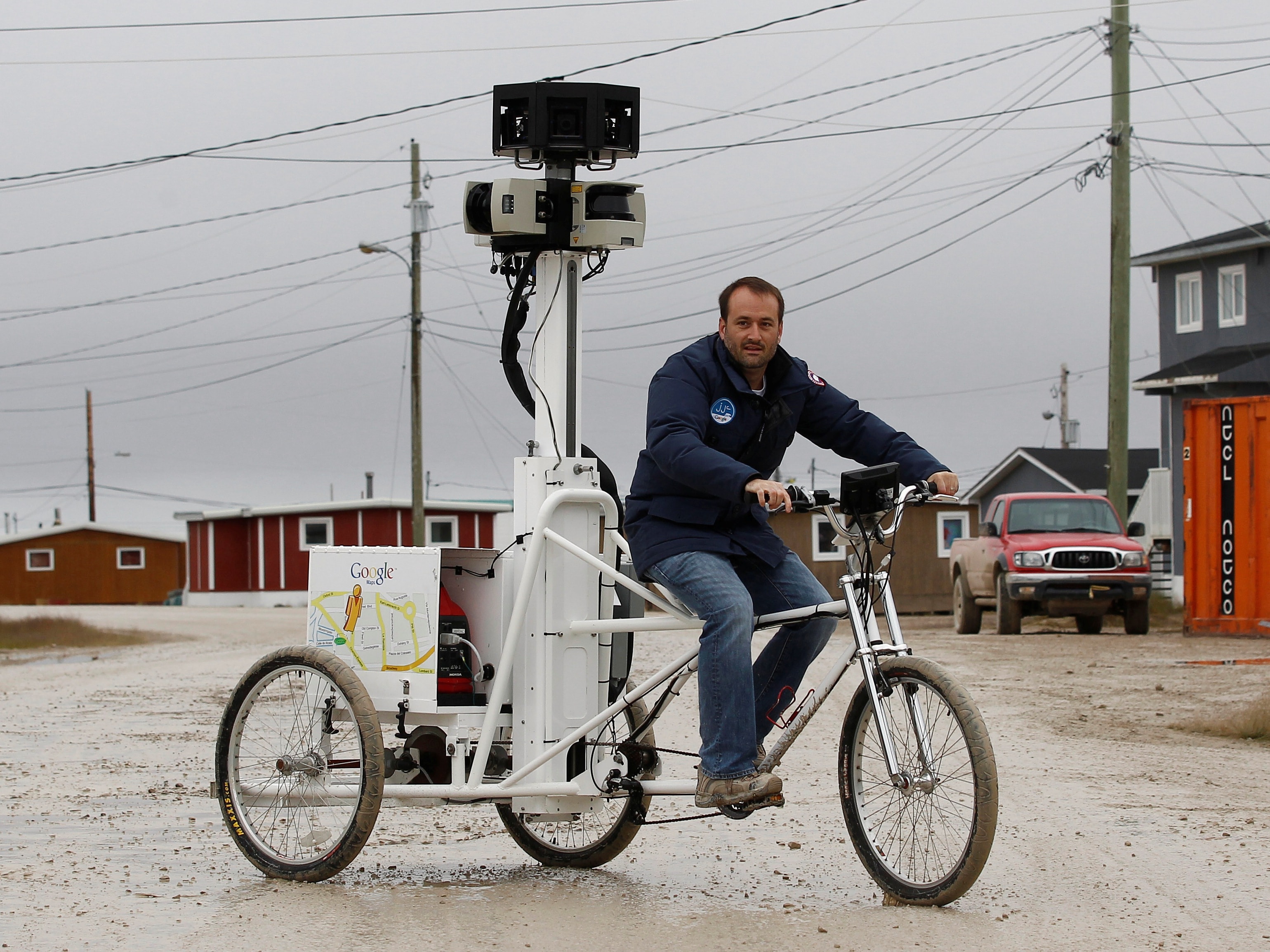 A man is pictured riding a Google Street View bicycle that mapped the area in Cambridge Bay, Nunavut, 23 August 2012, REUTERS/Chris Wattie