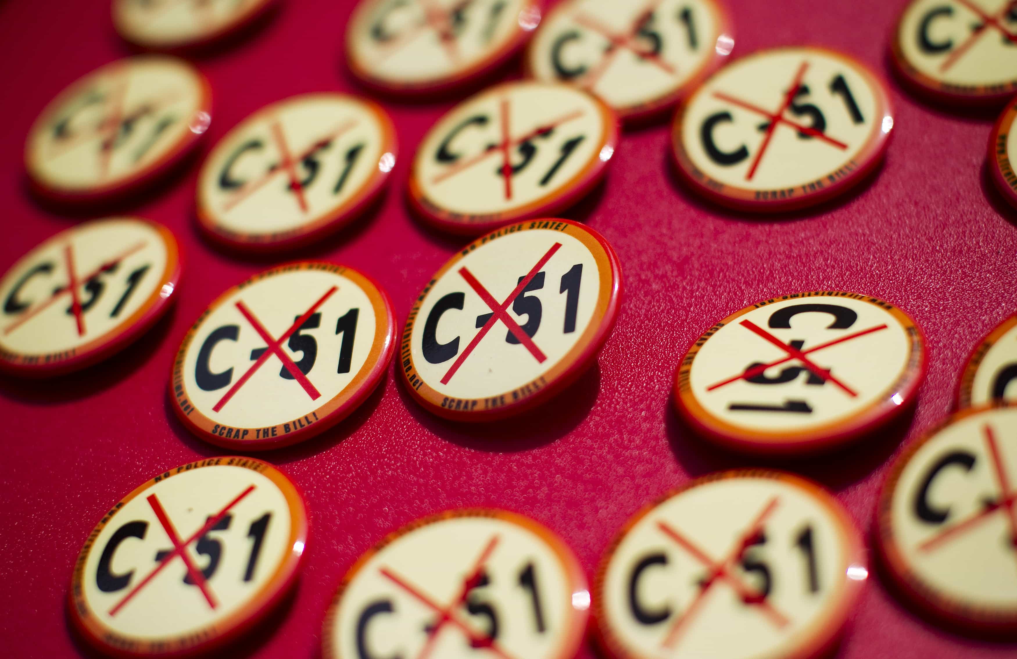 Pins are handed out during a rally against Bill C-51, the Canadian federal government's proposed anti-terrorism legislation in Vancouver, British Columbia April 18, 2015, REUTERS/Ben Nelms