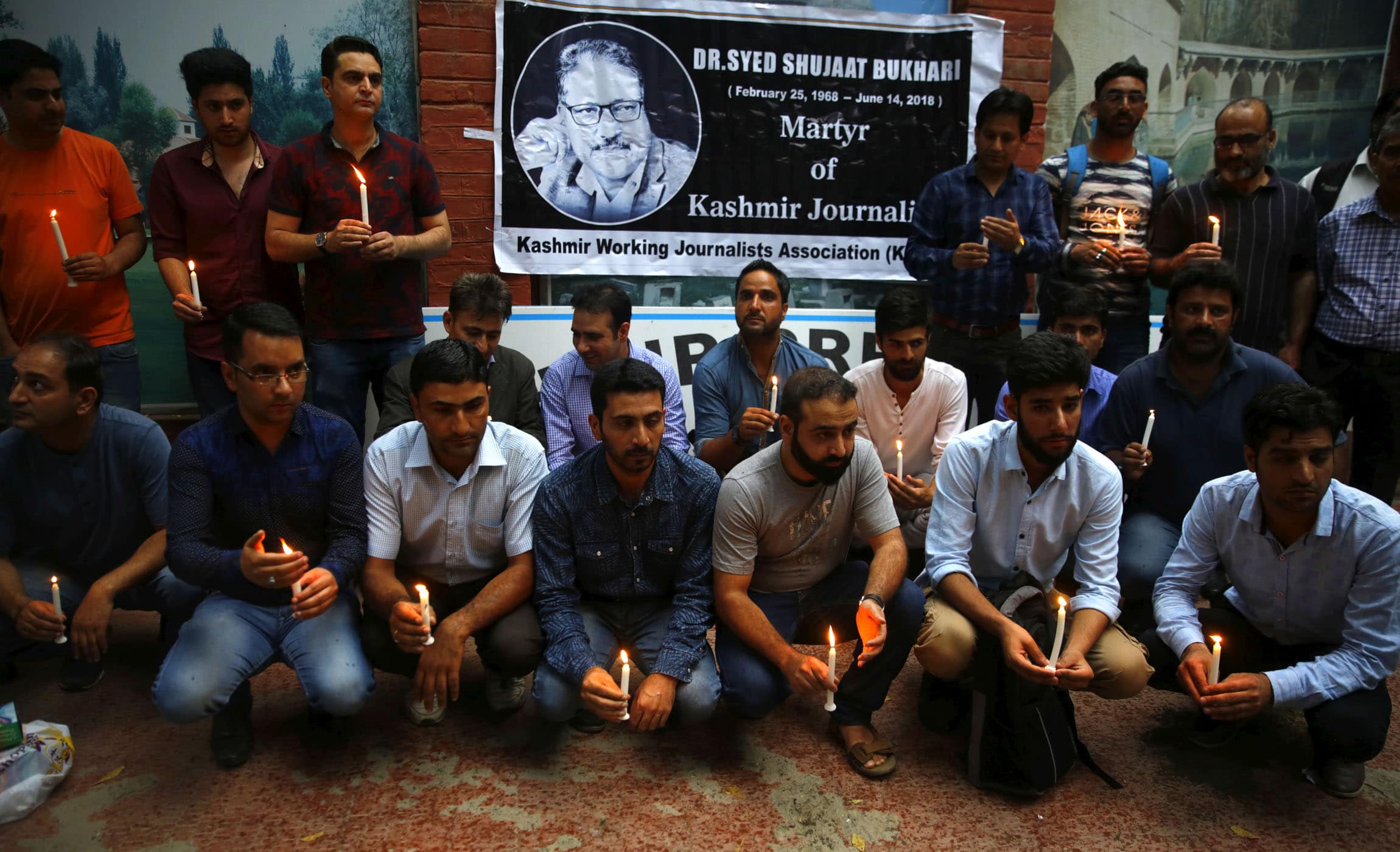 Kashmiri journalists hold a candle light vigil in memory of Rising Kashmir Founder and former Editor-in-Chief Shujaat Bukhari, Kashmir Press club, Srinagar, India, 2 July 2018, Waseem Andrabi/Hindustan Times via Getty Images