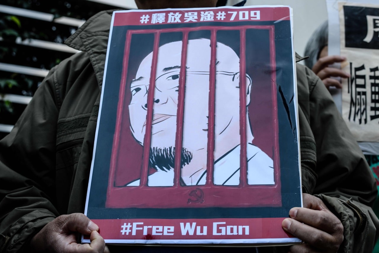 An activist holds a poster depicting the jailed Chinese activist Wu Gan during a protest outside the Chinese Liaison Office in Hong Kong, 27 December 2017, ANTHONY WALLACE/AFP/Getty Images