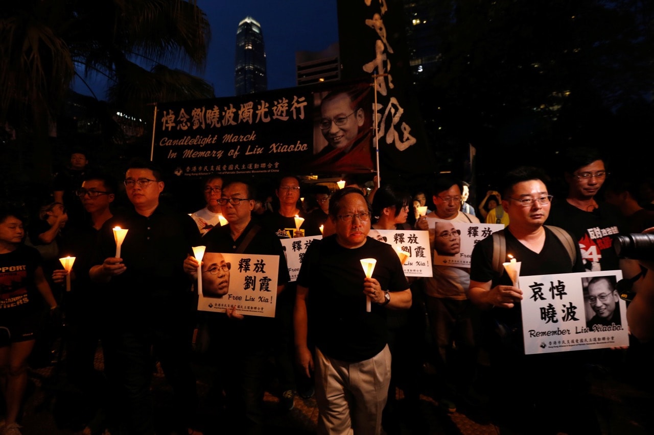 Protesters carrying candles take part in a march to mourn the death of Nobel Peace laureate Liu Xiaobo, in Hong Kong, China, 15 July 2017, REUTERS/Bobby Yip