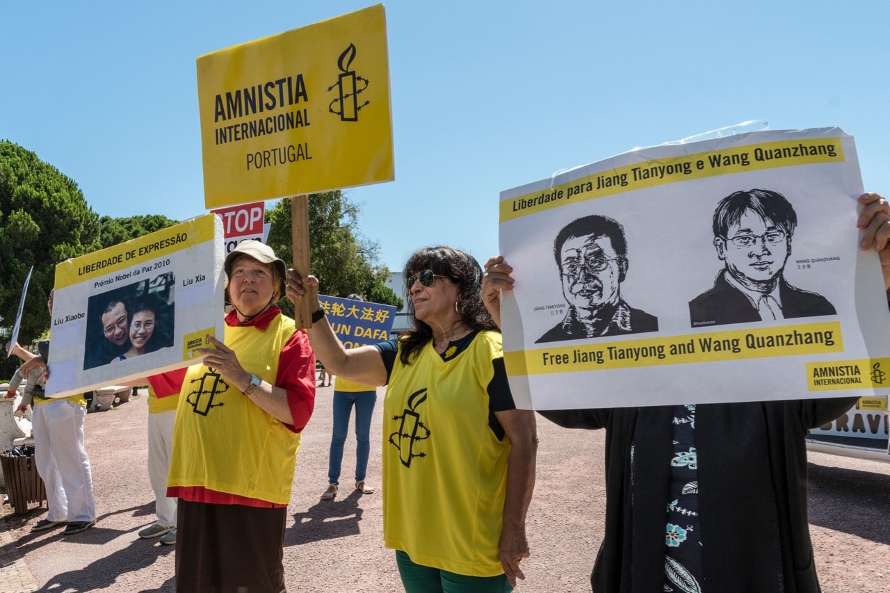 Members of the Portuguese chapter of Amnesty International demonstrate outside Belem Palace in favor of Chinese 2010 Nobel Peace Prize winner Liu Xiao, his wife Liu Xia, and lawyers Jiang Tianyong and Wang Quanzhang in Lisbon, 12 July 2017, Horacio Villalobos - Corbis/Corbis via Getty Images