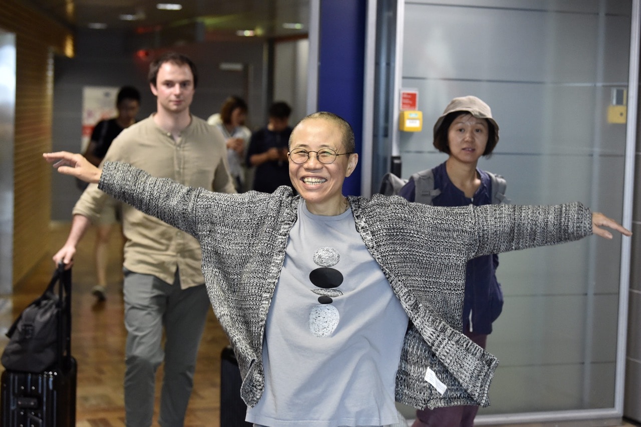 Liu Xia, the widow of Chinese Nobel dissident Liu Xiaobo, smiles as she arrives at the Helsinki International Airport in Vantaa, Finland, 10 July 2018, JUSSI NUKARI/AFP/Getty Images