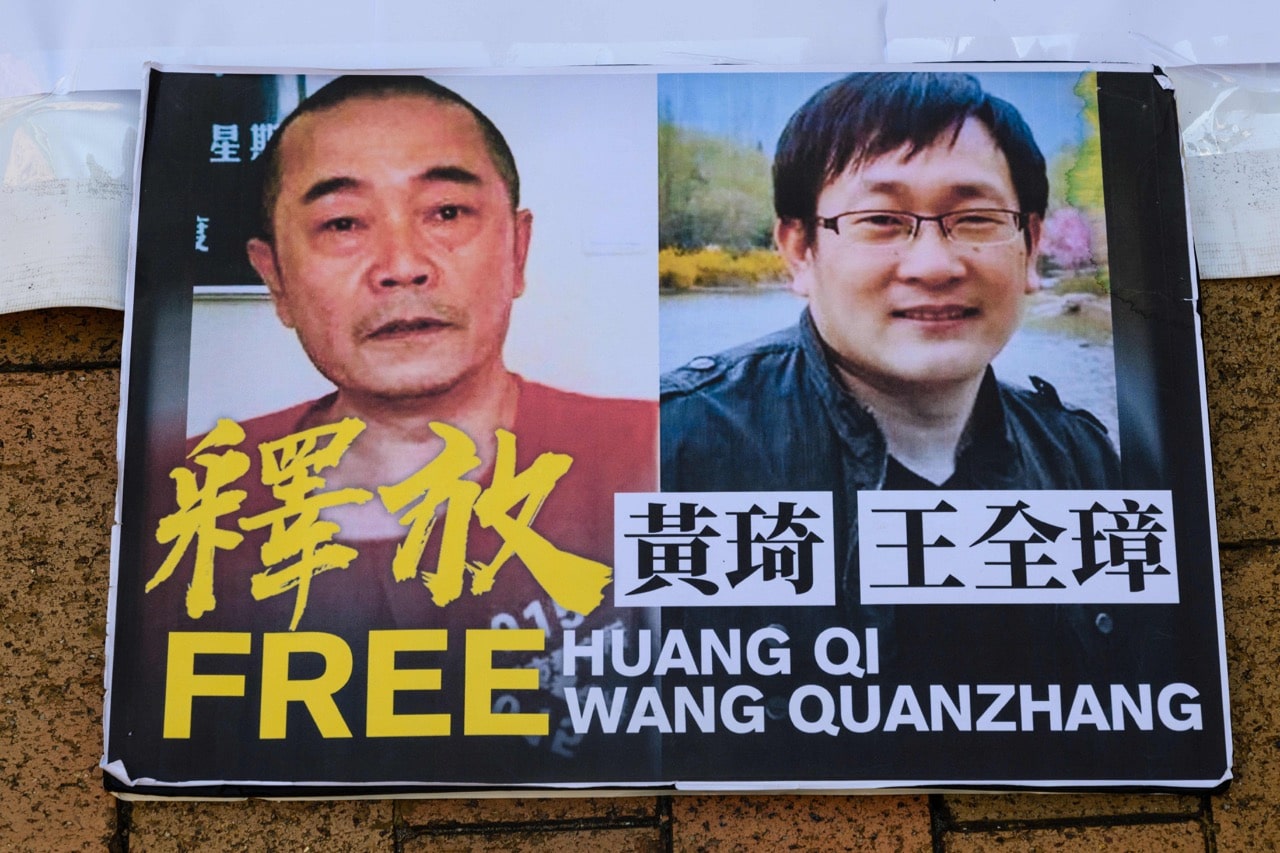 A placard in support of jailed Chinese human rights lawyer Wang Quanzhang (R) and 'cyber-dissident' Huang Qi (L) is seen during a protest in Hong Kong, 29 January 2019, ANTHONY WALLACE/AFP/Getty Images