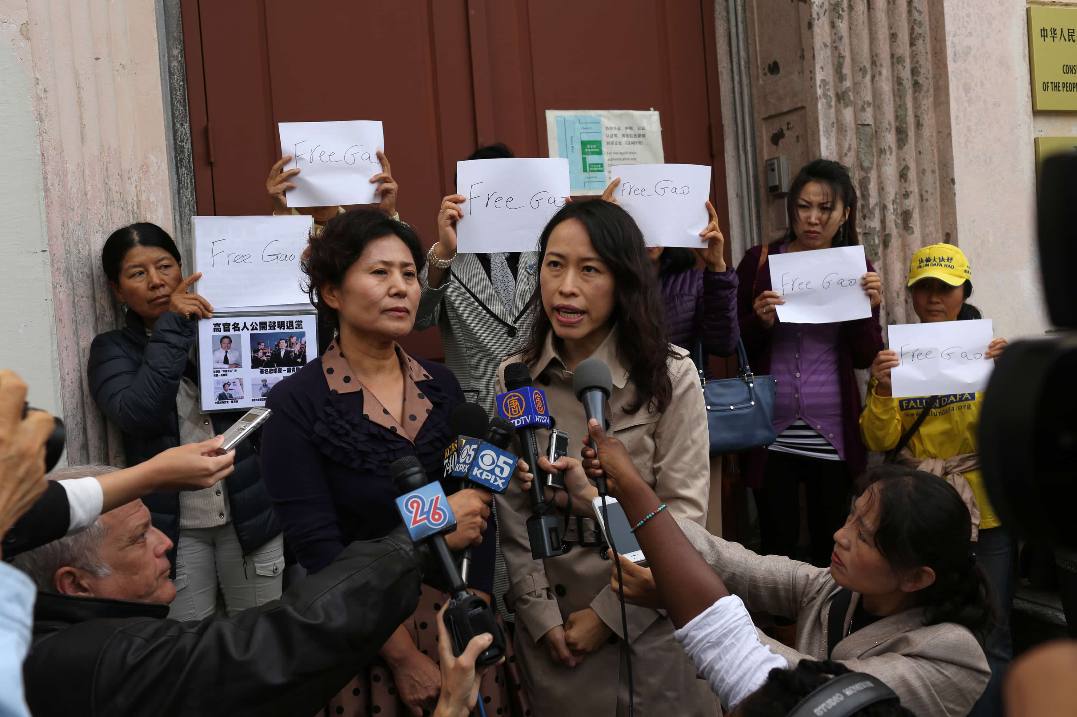 Geng He (L), wife of Gao Zhisheng, speaks through her interpreter, Sherry Zhang, at a news conference at the Chinese Consulate in San Francisco, California, 7 August 2014, REUTERS/Robert Galbraith