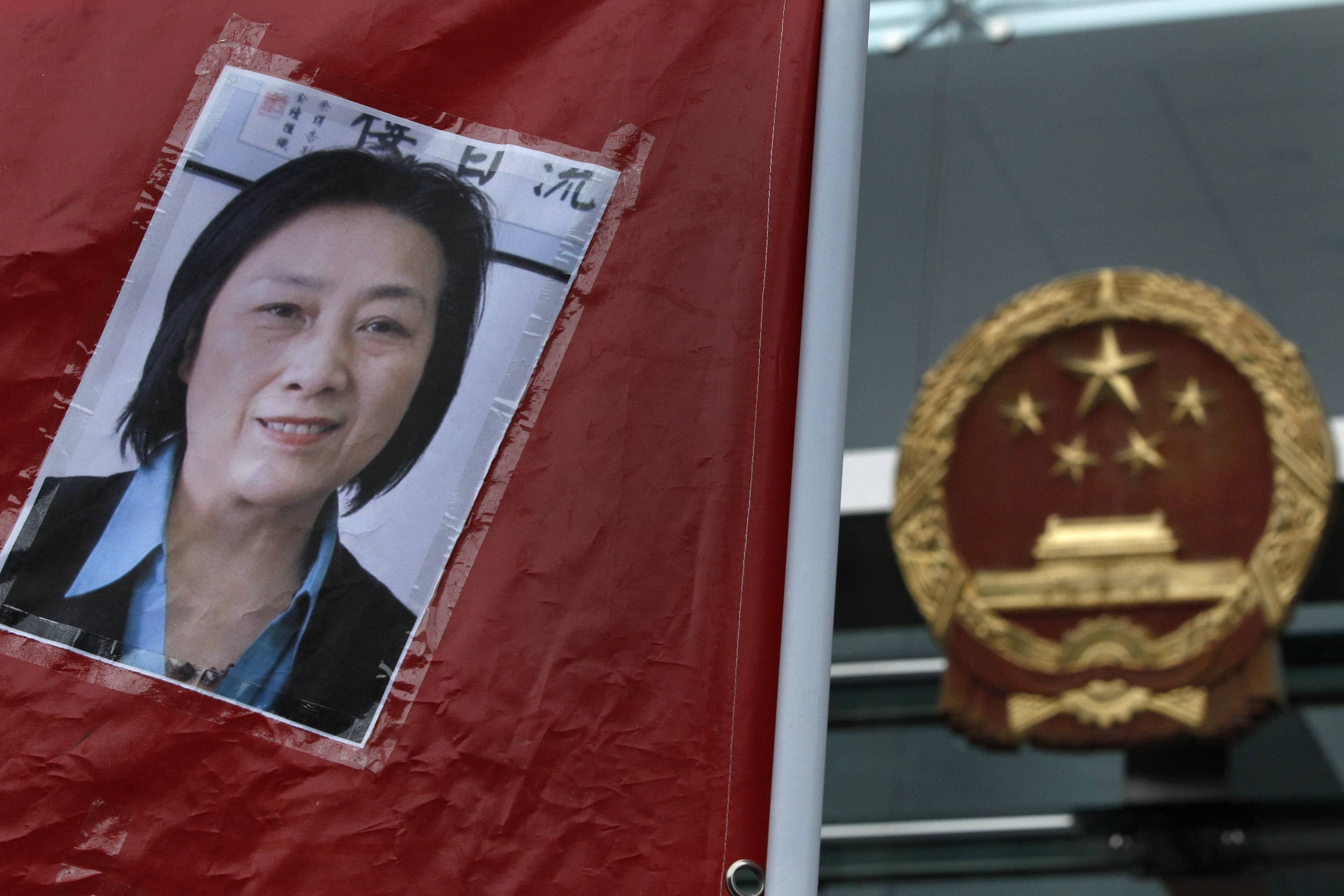 A picture of Chinese journalist Gao Yu is displayed during a protest calling for her release and that of others, outside the Chinese liaison office in Hong Kong, 11 May 2014, AP Photo/Vincent Yu