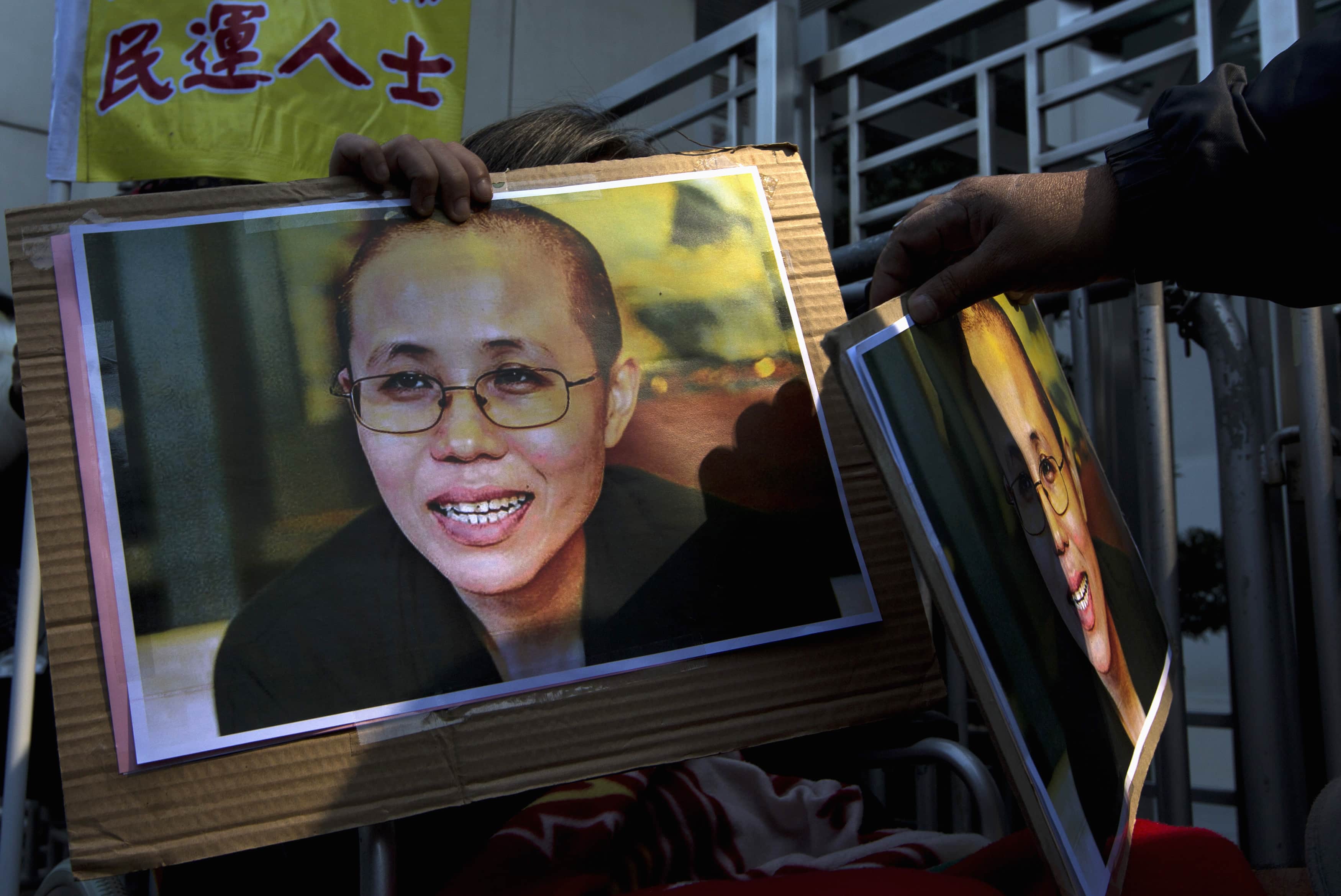 A portrait of Liu Xia is displayed during a protest calling for the release of Chinese dissidents outside the Chinese liaison office in Hong Kong, 5 December 2013, REUTERS/Tyrone Siu