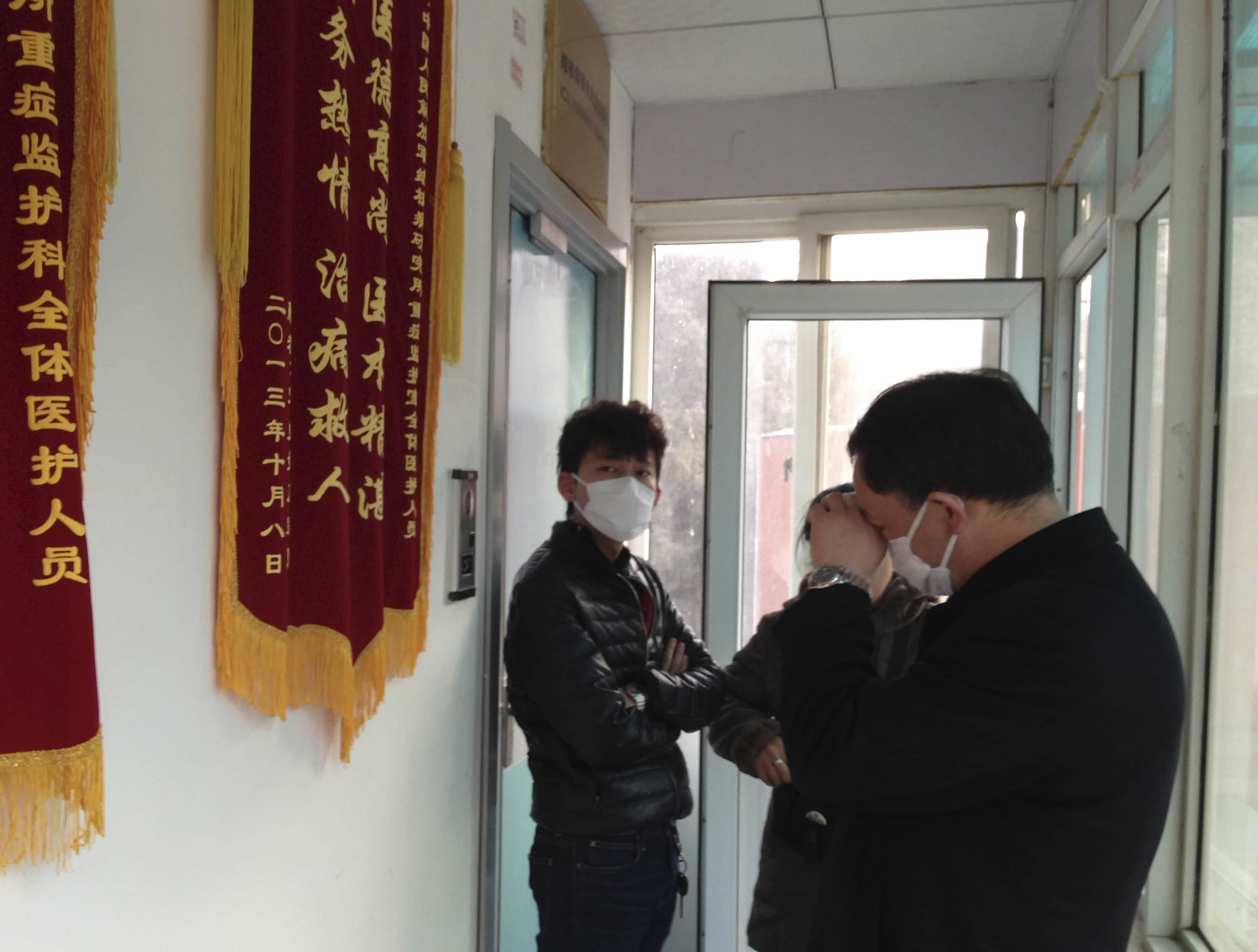 On 1 March 2014, friends of Cao Shunli stood in front of an intensive care unit at a Beijing hospital where the activist was treated as they were not allowed to go inside, REUTERS/Kim Kyung-Hoon