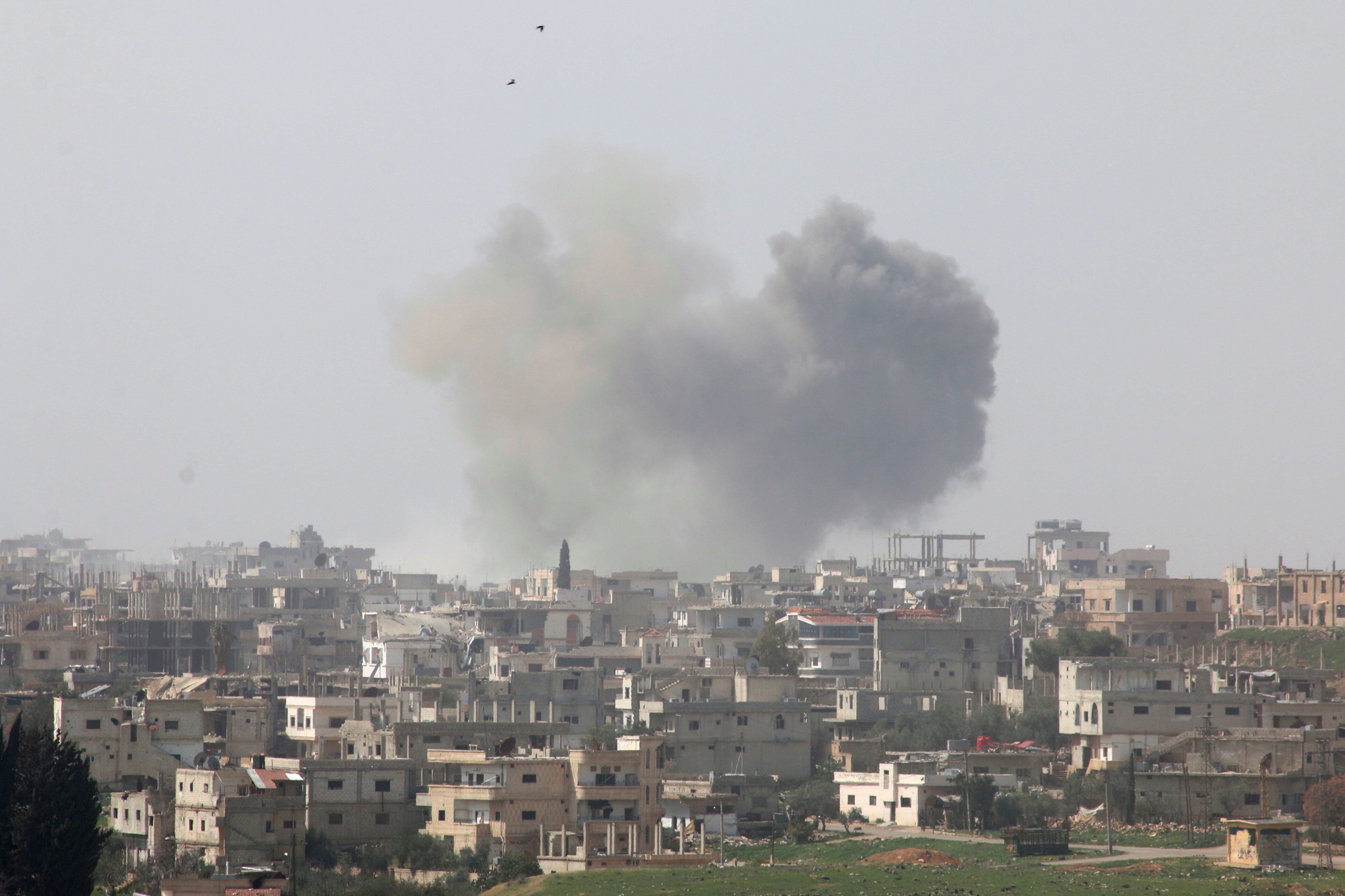 Smoke rises after strikes on rebel-held Deraa city, Syria March 10, 2017, REUTERS/Alaa Al-Faqir