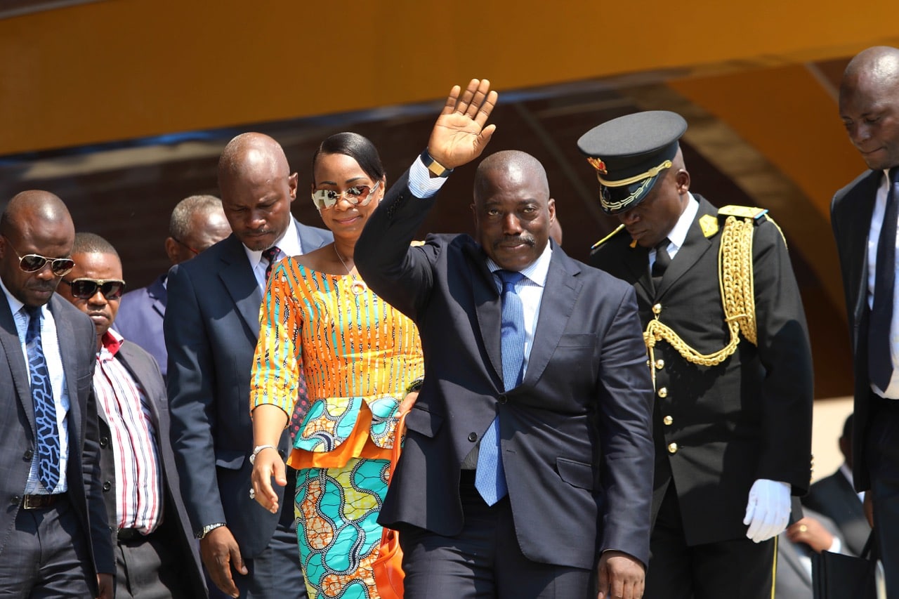 In this 30 June 2016 file photo, Congolese President Joseph Kabila, center, waves as he and others celebrate the Democratic Republic of Congo, DRC, independence in Kindu, Congo, AP Photo/John Bompengo, File