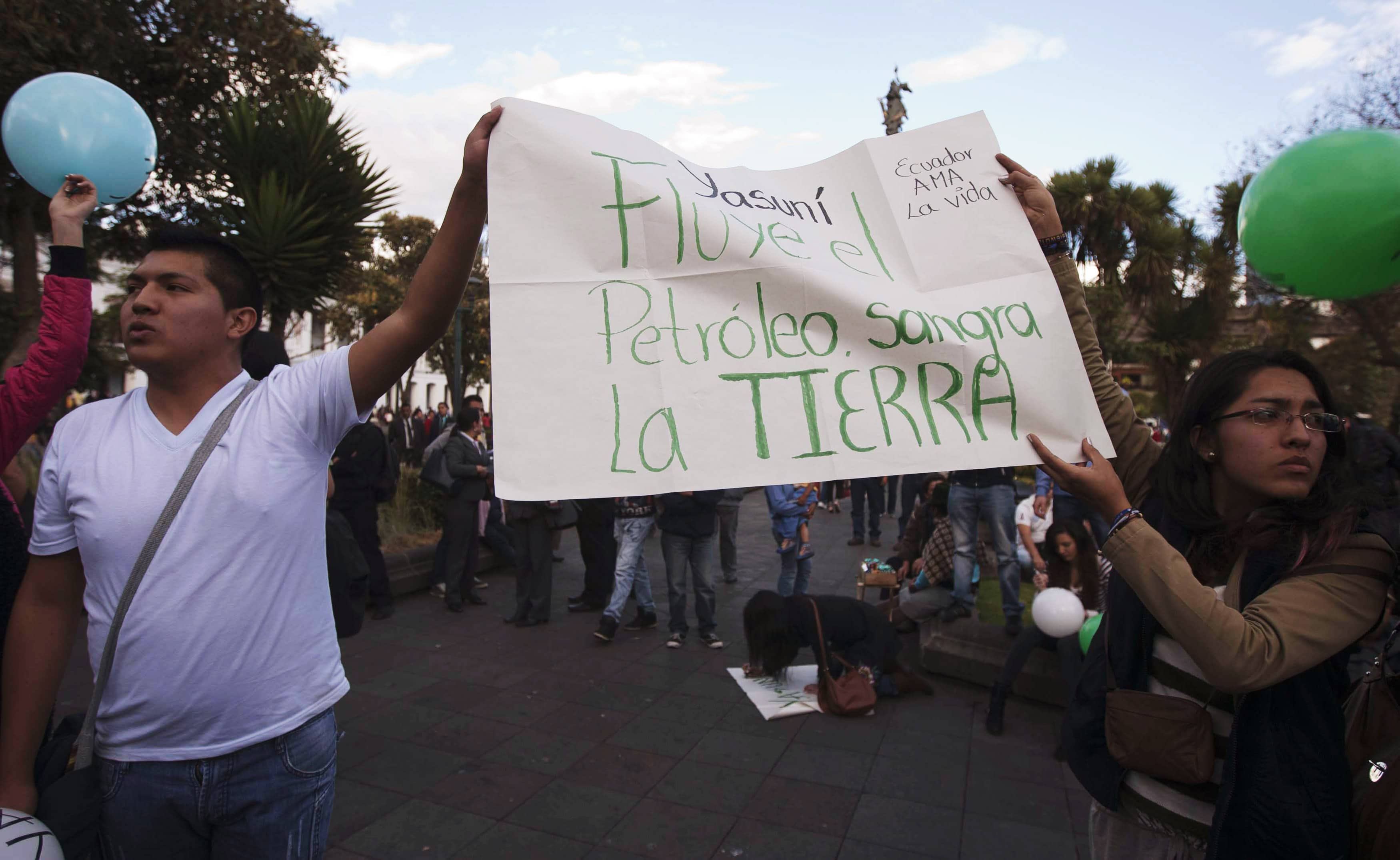 Demonstrators shout slogans during a rally calling for the government to keep the Yasuni initiative in place, outside Carondelet Palace in Quito, 15 August 2013. , REUTERS/Javier Amores