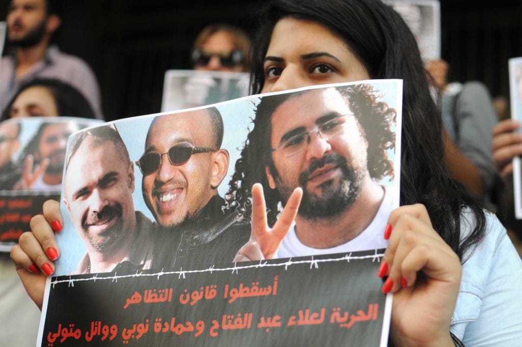 Activists demand freedom for Alaa Abd El Fatah, in front of the Ministry Of Justice, in Cairo, Egypt, 15 June 2014, NurPhoto/Corbis via Getty Images