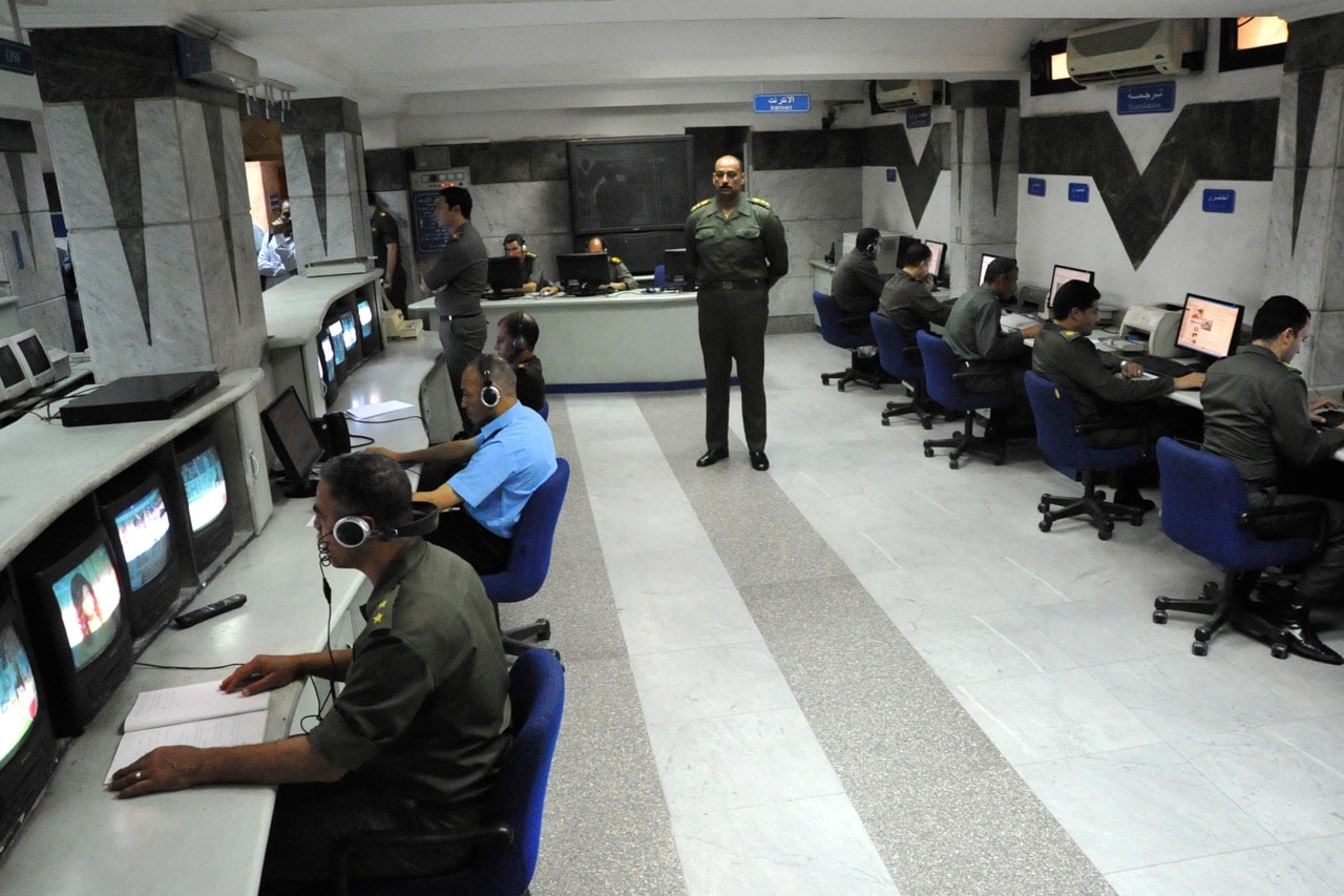 Egyptian army officers monitor local and international TV stations and websites at the military press office department in Cairo, 16 June 2012, -/AFP/GettyImages