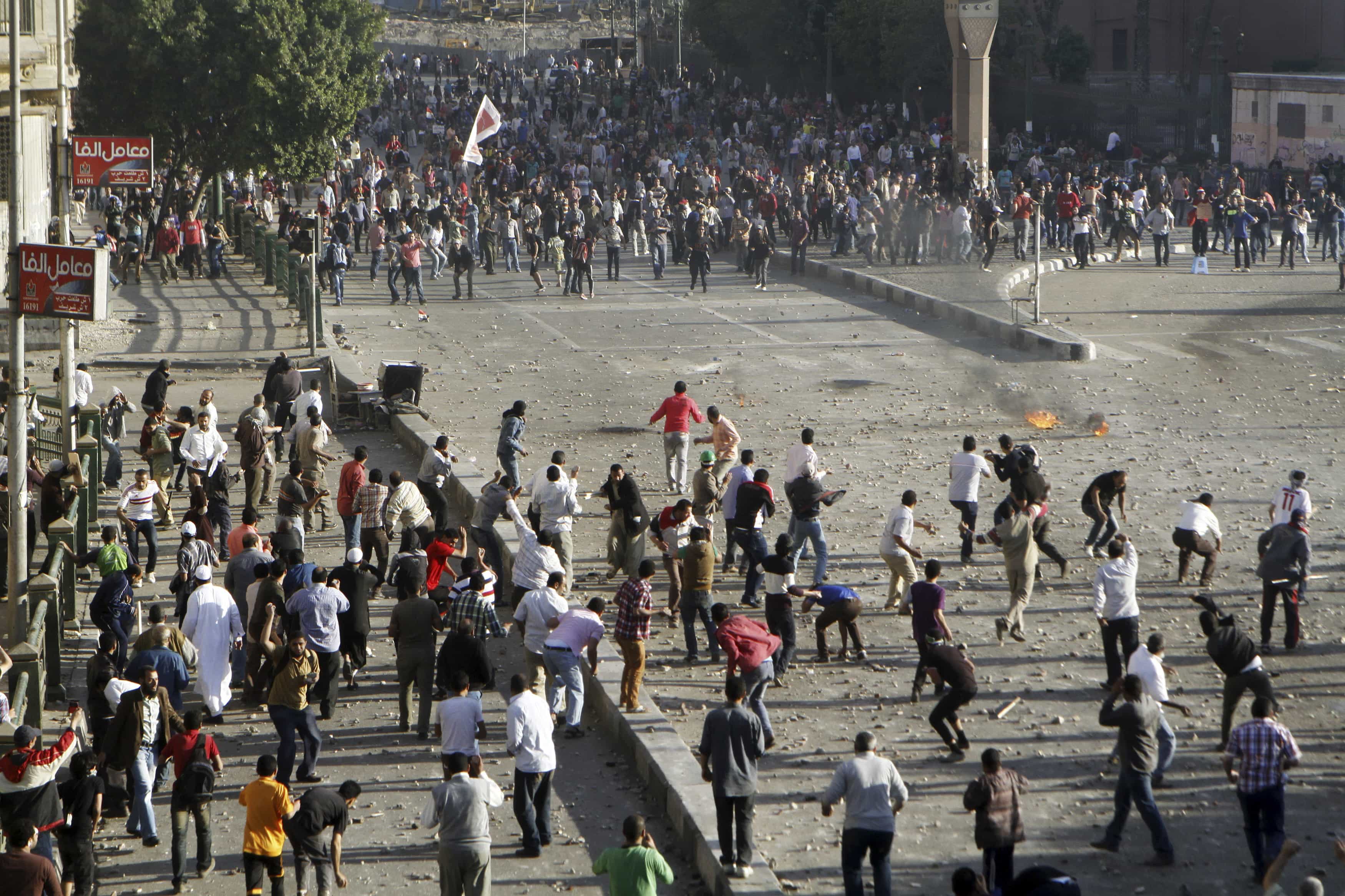 Anti-government protesters clash with Muslim Brotherhood members near Cairo's Tahrir Square on 19 April 2013, REUTERS/Mohamed Abd El Ghany