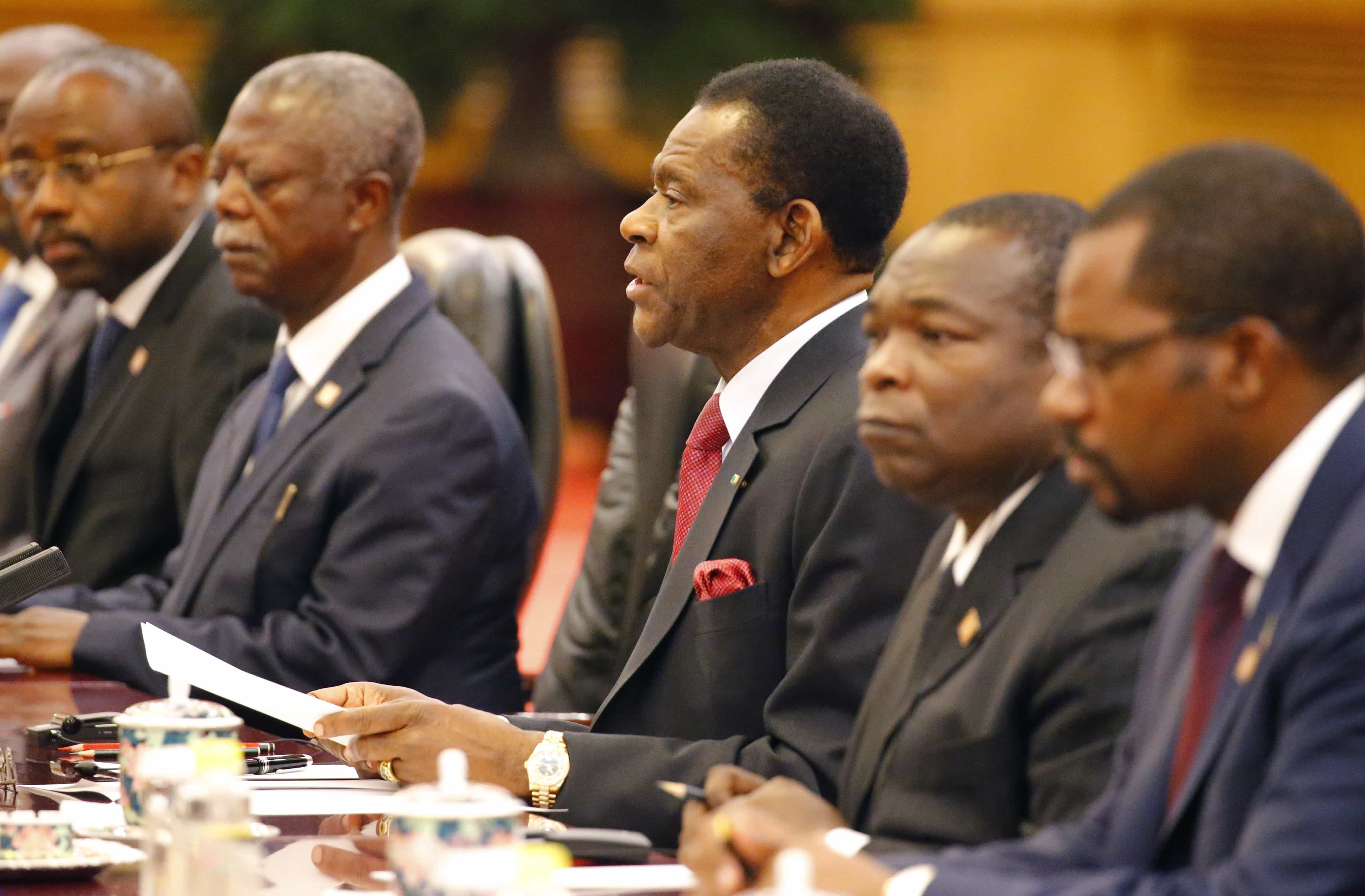 Equatorial Guinea's President Teodoro Obiang Nguema Mbasogo, center, talks with Chinese President Xi Jinping during a meeting in Beijing, 28 April 2015., Shigeru Nagahara/Pool Photo via AP