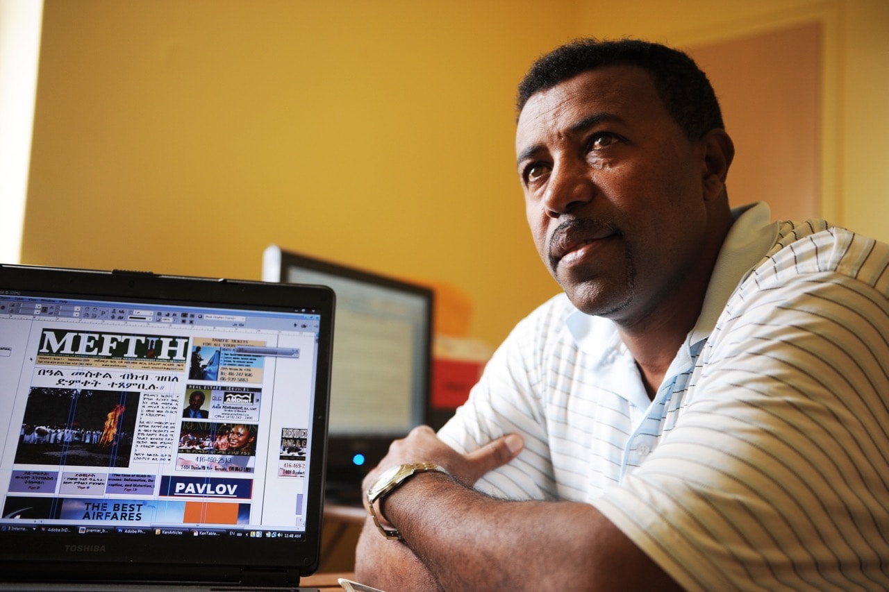 Exiled Eritrean journalist Aaron Berhane is pictured in his home office in Toronto, Canada, where he puts together an Eritrean community newspaper, 30 September 2009, Colin McConnell/Toronto Star via Getty Images