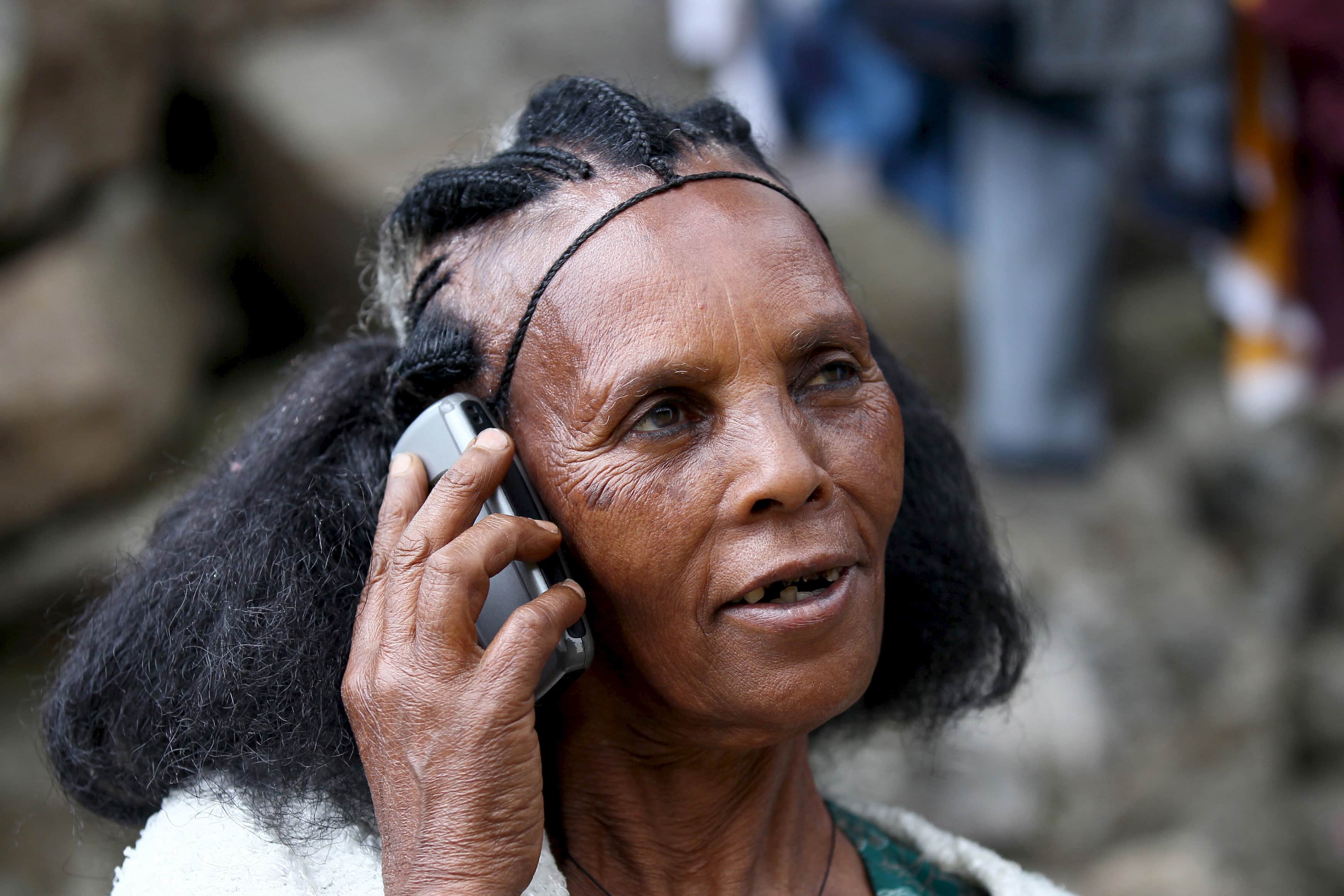 A woman makes a call on her mobile phone in Ethiopia's capital, Addis Ababa, 9 November 2015, REUTERS/Tiksa Negeri