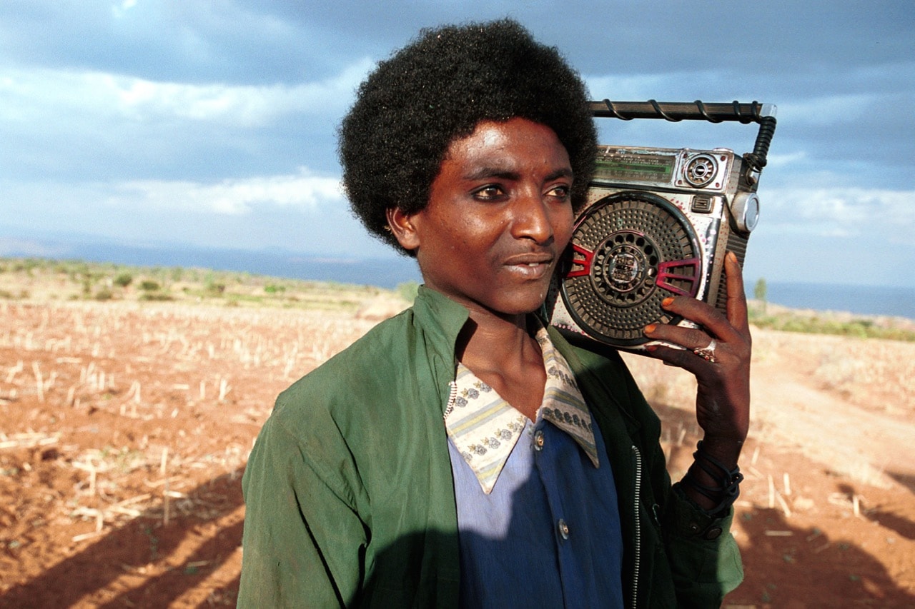 A young man plays his radio during a wedding ceremony in Erer Valley, rural eastern Ethiopia, 8 February 2001, Per-Anders Pettersson/ Getty Images