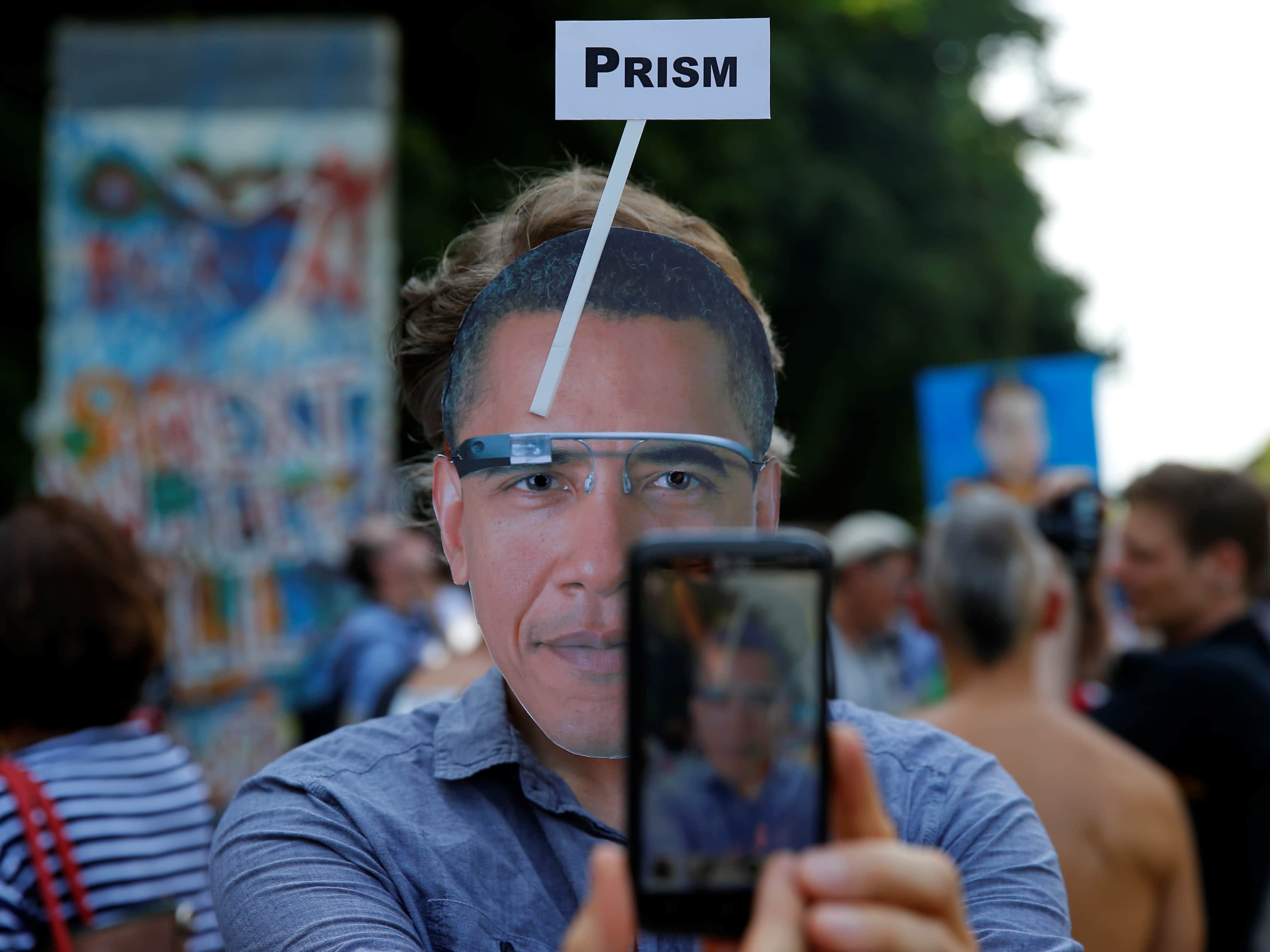 A member of German Piraten Partei (Pirates party) wears a mask depicting U.S. President Barack Obama sporting Google Glass during a protest in Berlin, 19 June 2013, REUTERS/Pawel Kopczynski