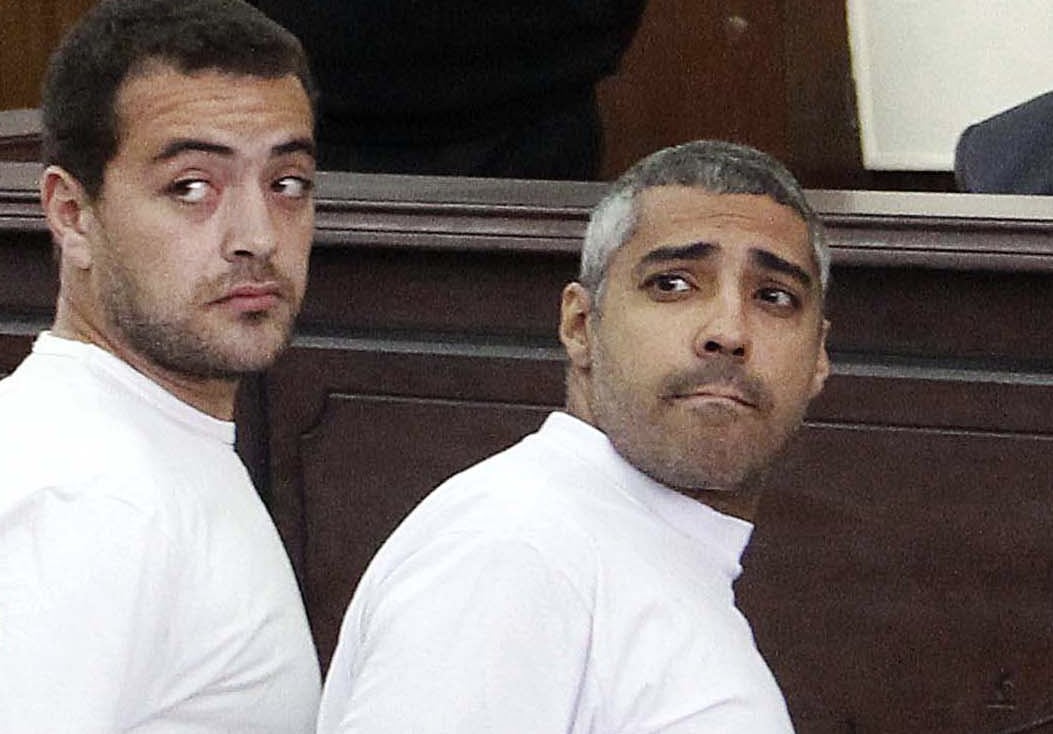 Al-Jazeera English producer Baher Mohamed, left, Canadian-Egyptian acting Cairo bureau chief Mohammed Fahmy, AP Photo/Heba Elkholy, El Shorouk, File