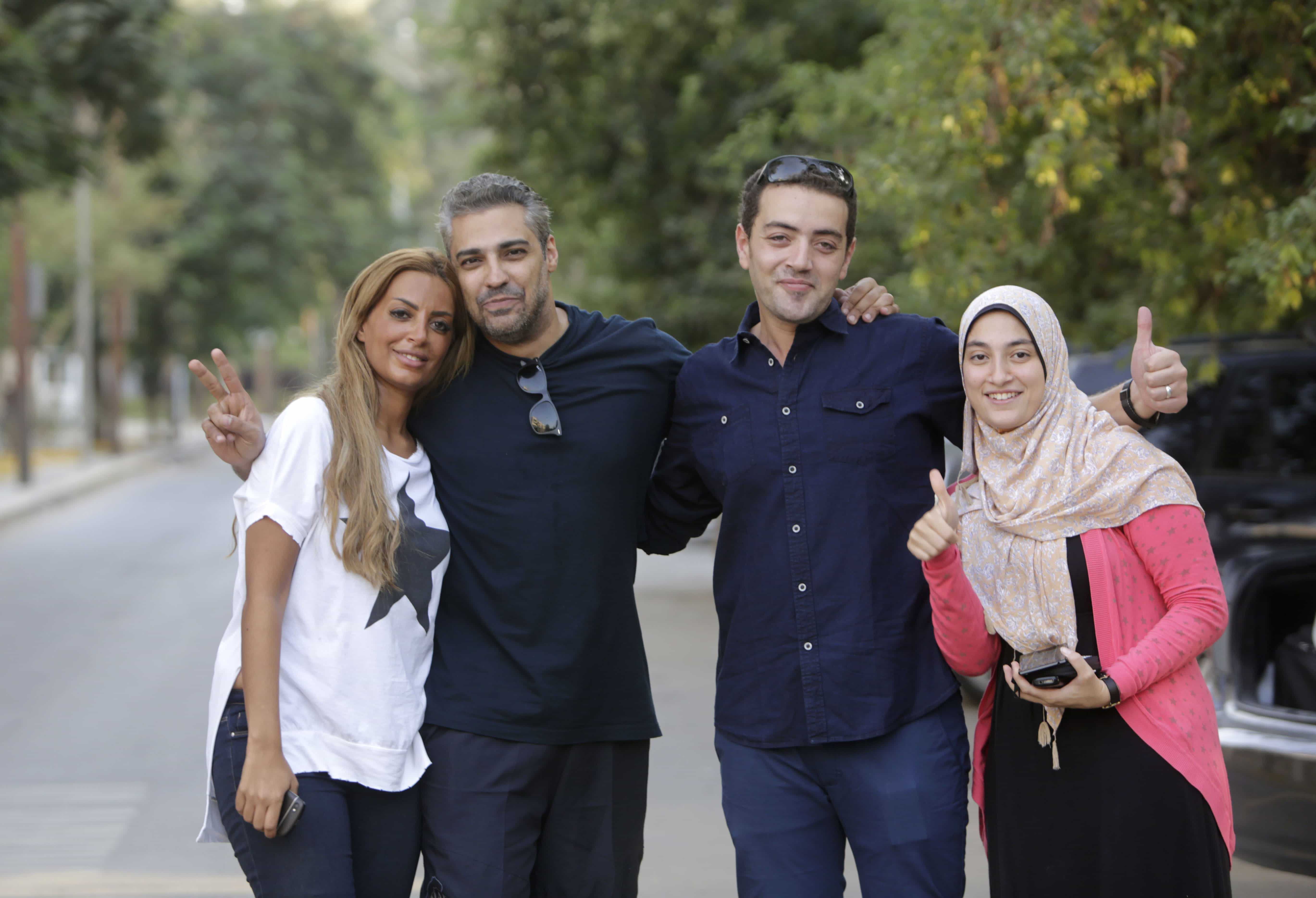 Mohamed Fahmy second left, and his colleague Baher Mohammed, celebrate with their wives after being released from Torah prison in Cairo on 23 September 2015, AP Photo/Amr Nabil