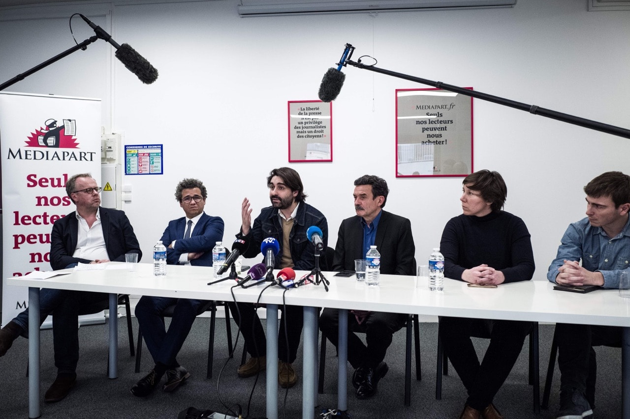 The co-founder of Mediapart Edwy Plenel (3rdR) and Mediapart journalist Fabrice Arfi (3rdL) take part in a press conference at the website's offices in Paris, France, 4 February 2019,  PHILIPPE LOPEZ/AFP/Getty Images