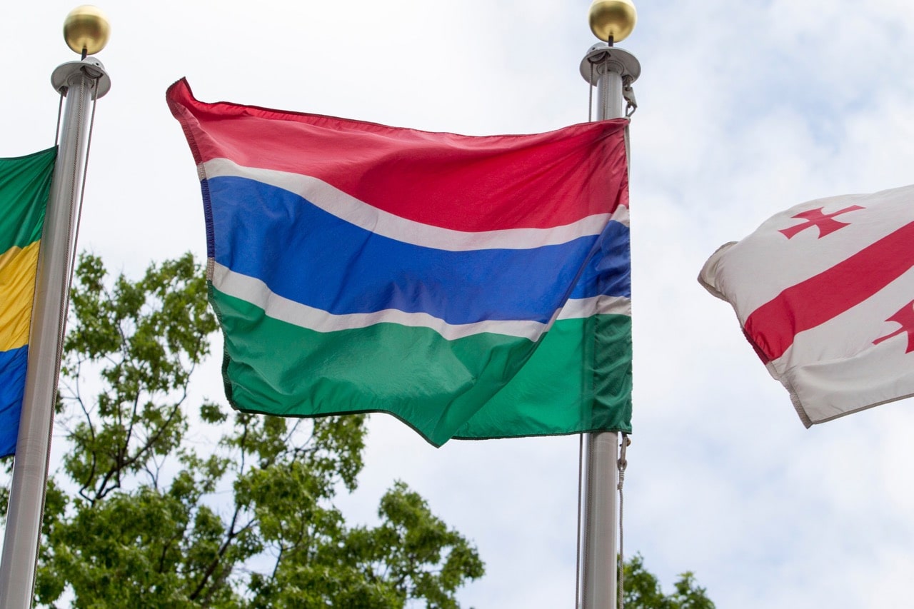 The flag of the Islamic Republic of the Gambia (centre) flying at United Nations headquarters in New York, 14 July 2016, UN Photo/Loey Felipe